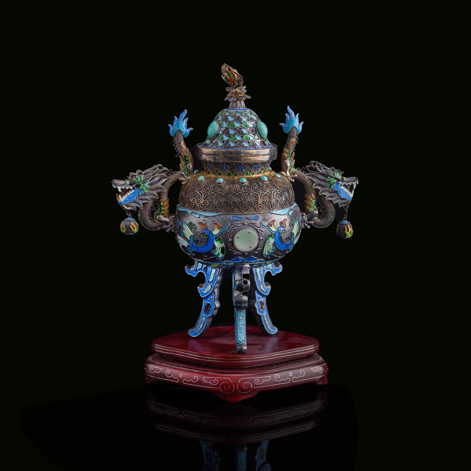 A Chinese hardstone-inlaid silver enamel censer, Republic period: A Chinese hardstone-inlaid silver enamel censer Republic period With "925", "A3" and "SILVER" marks to underside. Sold with associated wooden stand. H: 7 1/2, W: 6 3/4, D: 3 3/4 in. (H: 19.1, W: 17.1,