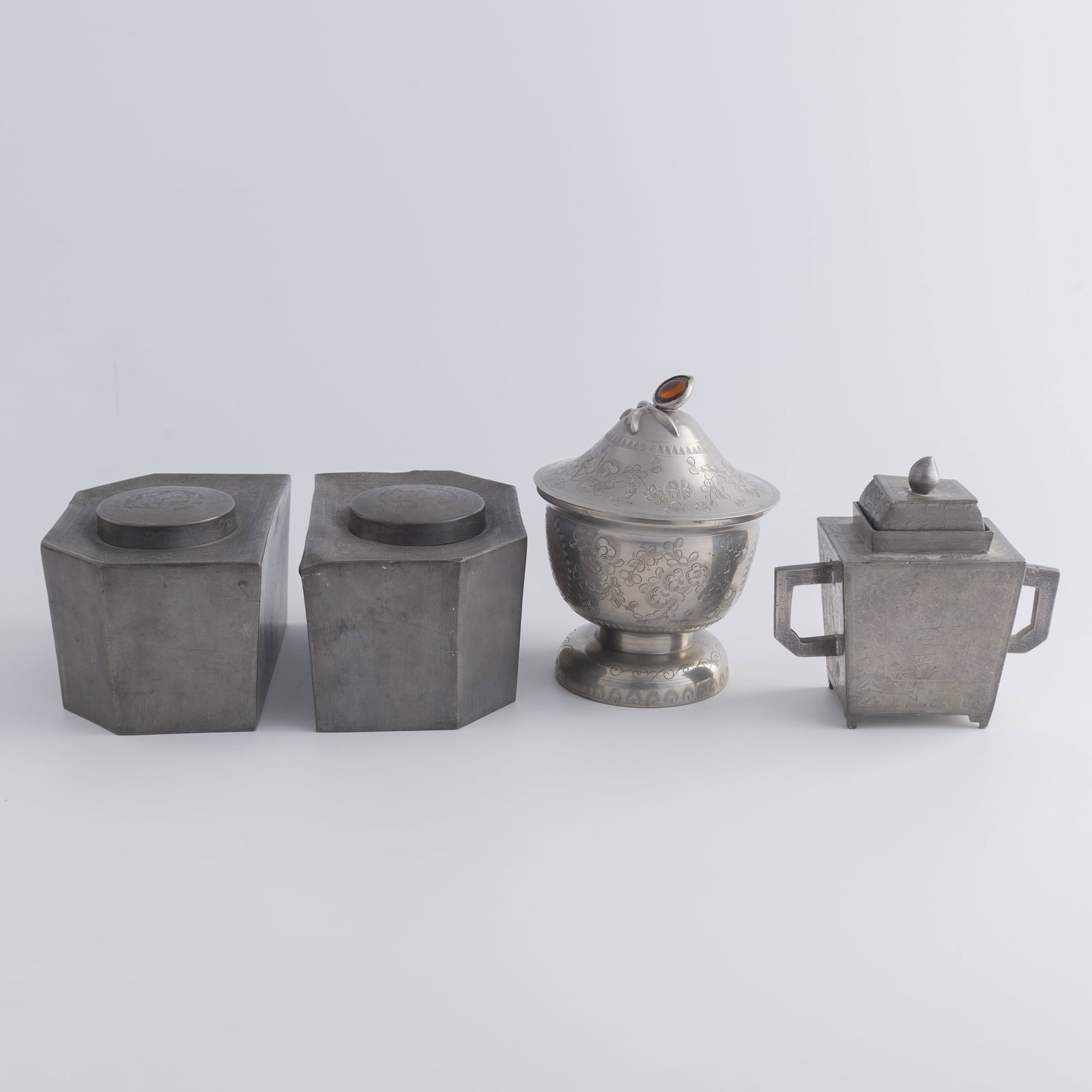 Four Chinese pewter vessels, Qing dynasty/Republic period: Four Chinese pewter vessels Qing dynasty/Republic period One fitted with a glass inner liner, the outer base bearing a "CHINA" mark. (4). H: 6 1/4, Dia: 4 7/8 in. (H: 15.9, Dia: 12.4 cm. (tallest)) We