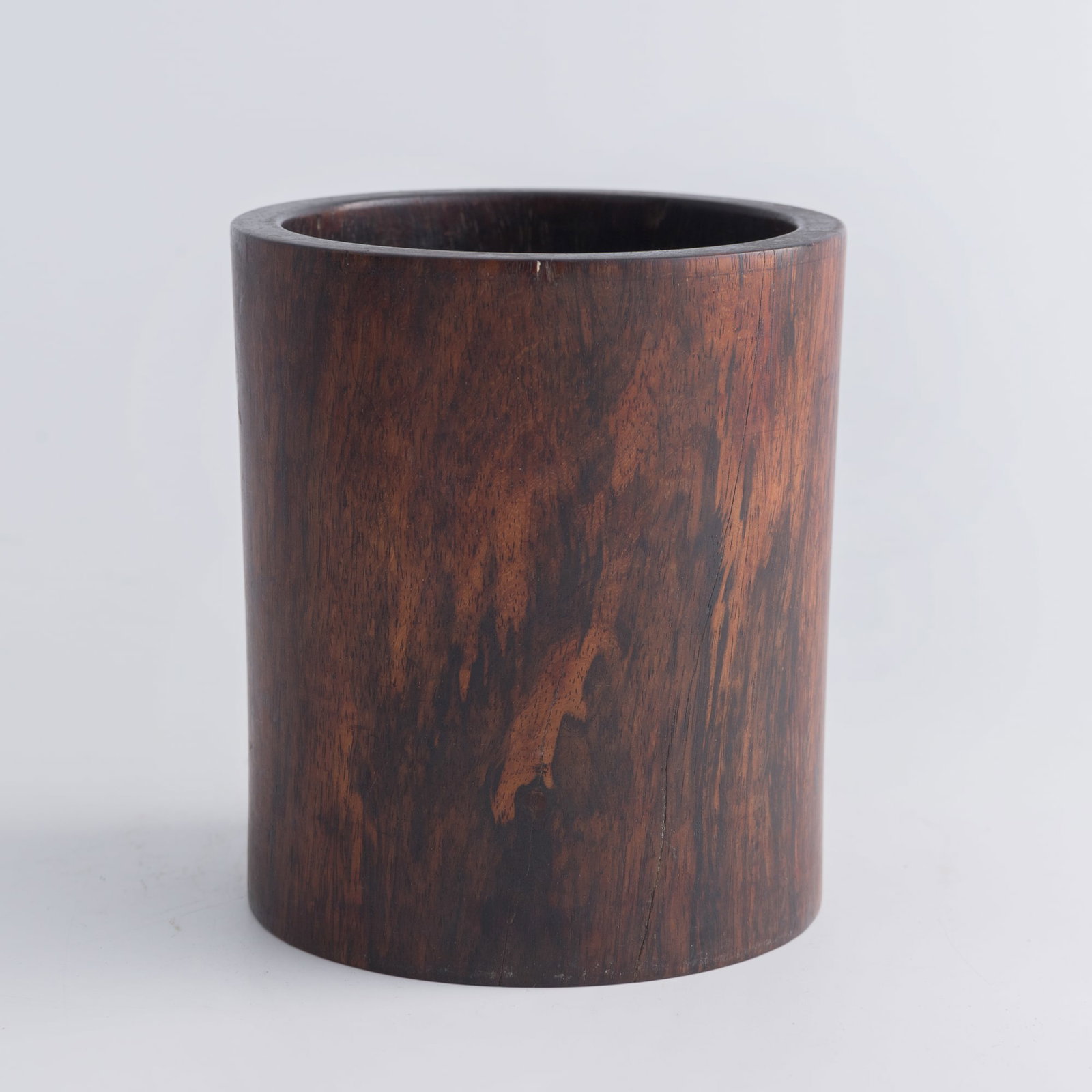 A Chinese huanghuali brush pot, 18th century: A Chinese huanghuali brush pot 18th century H: 5, Dia: 4 3/8 in. (H: 12.7, Dia: 11.1 cm.) Private estate, New Orleans, Louisiana. Click here for high r