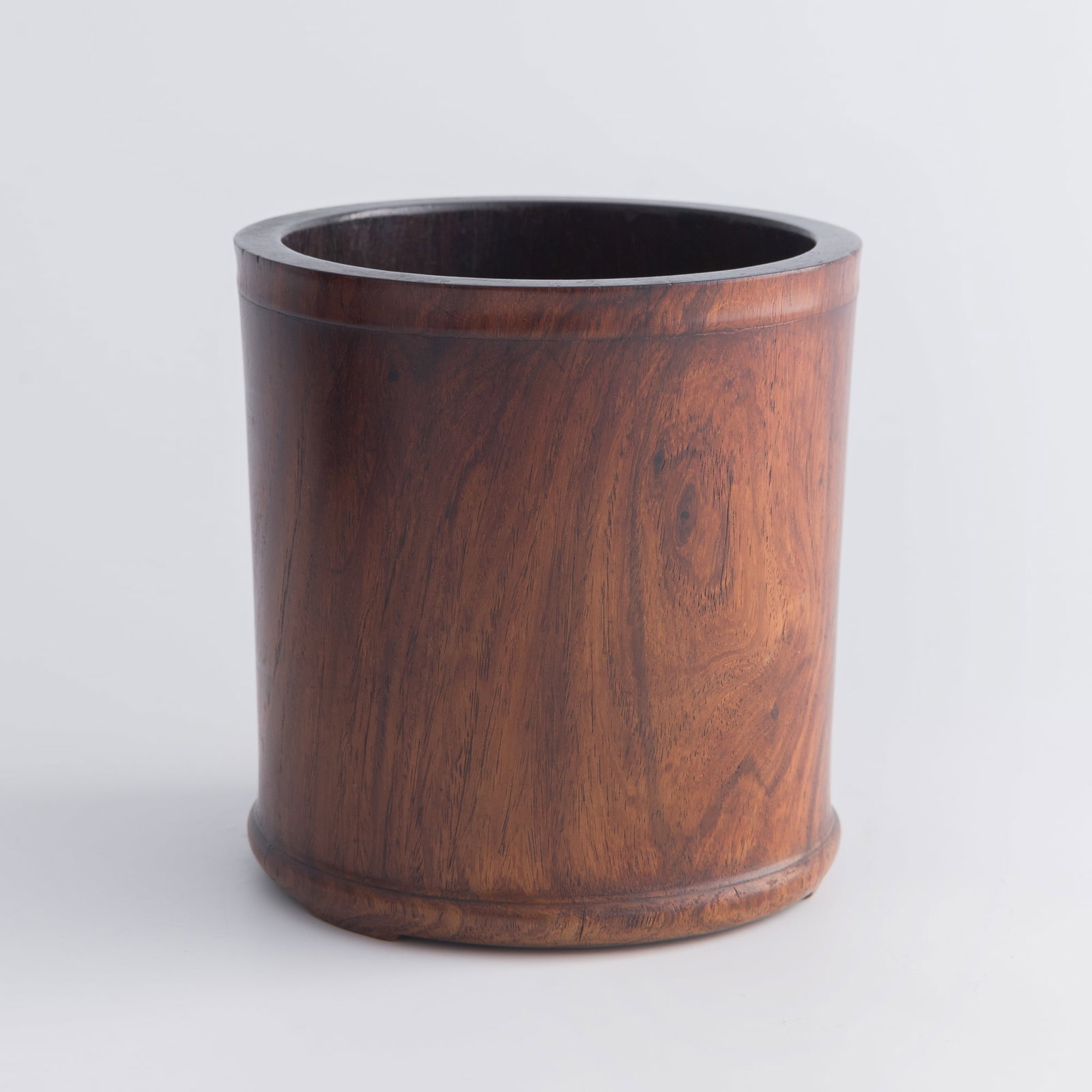 A Chinese huanghuali brush pot, 18th century: A Chinese huanghuali brush pot 18th century H: 6 1/4, Dia: 5 7/8 in. (H: 15.9, Dia: 14.9 cm.) Private estate, New Orleans, Louisiana. Click here for hi