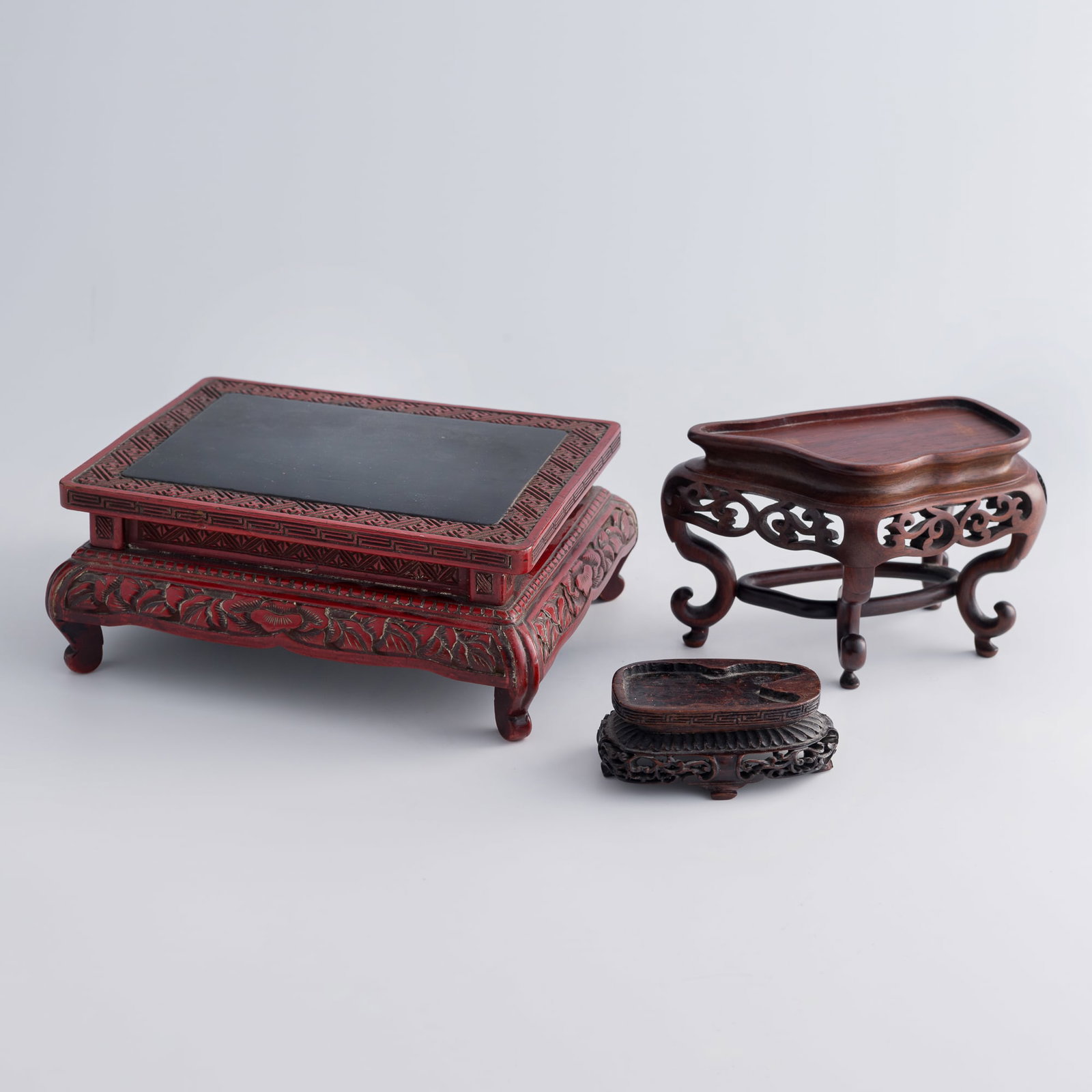 Two Chinese hardwood stands and a lacquer stand, Qing dynasty (1 of 10)