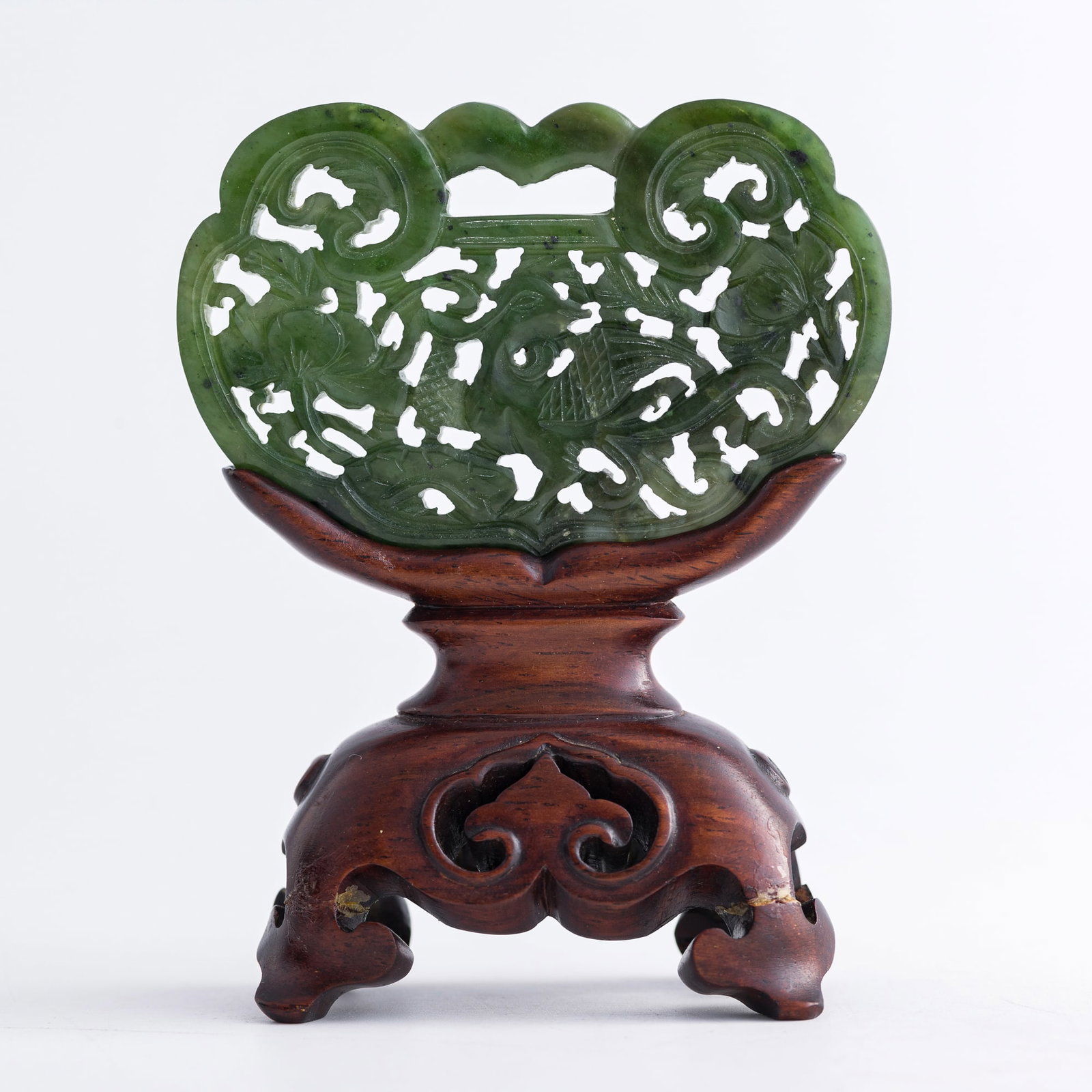 A Chinese spinach jade 'phoenix and peony' lock-form plaque, 18th century (1 of 10)
