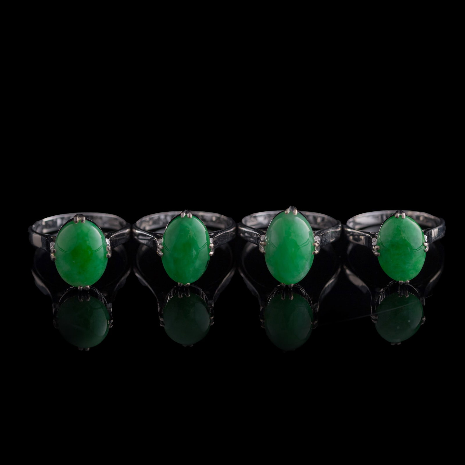 Four Chinese jadeite-set metal rings (1 of 8)