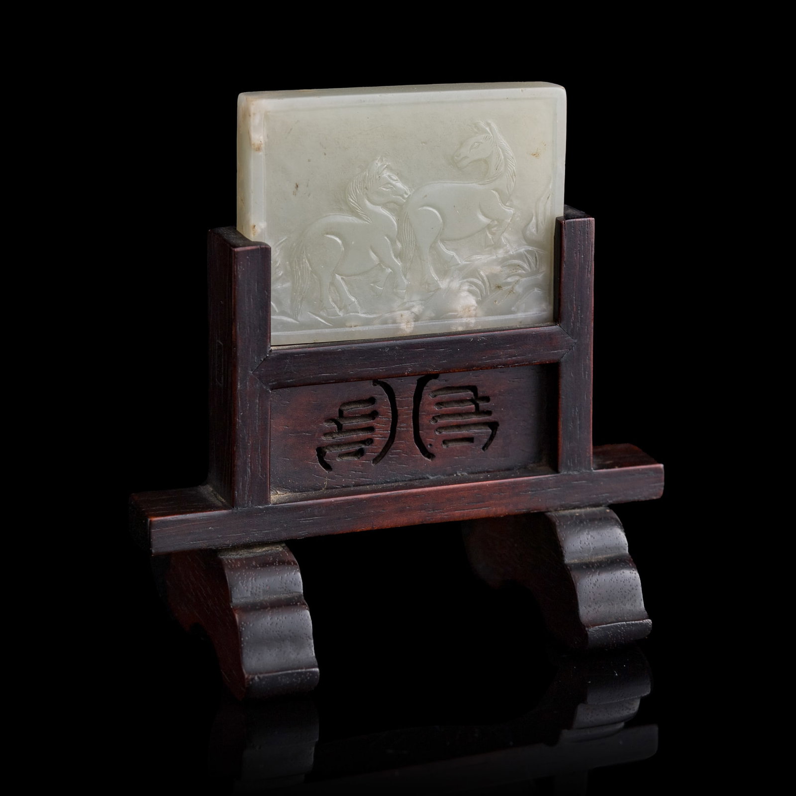 A small Chinese white jade 'double horses' inkstone screen, 19th century: A small Chinese white jade 'double horses' inkstone screen 19th century Sold with associated wooden stand. Jade: H: 1 1/2, W: 2, D: 3/8 in. (H: 3.8, W: 5.1, D: 1 cm.) Overall height: 3 1/2 in. (8.9 cm