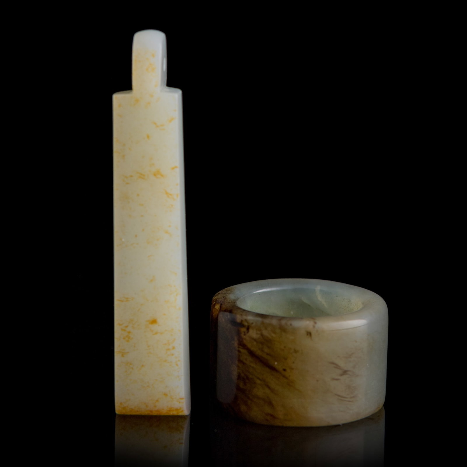 A Chinese white jade court hat plume holder and a jade archer's ring, Qing dynasty (1 of 9)