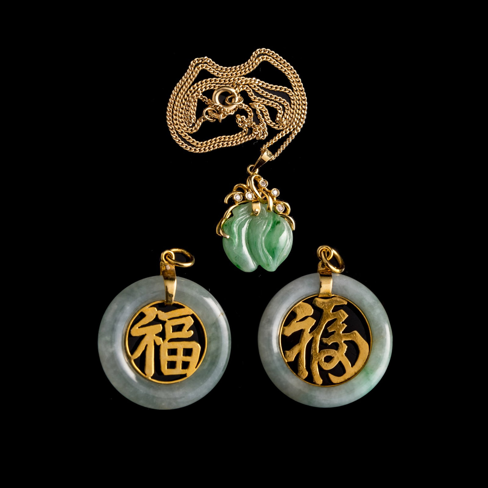 A Chinese jadeite necklace and two jadeite discs (1 of 6)