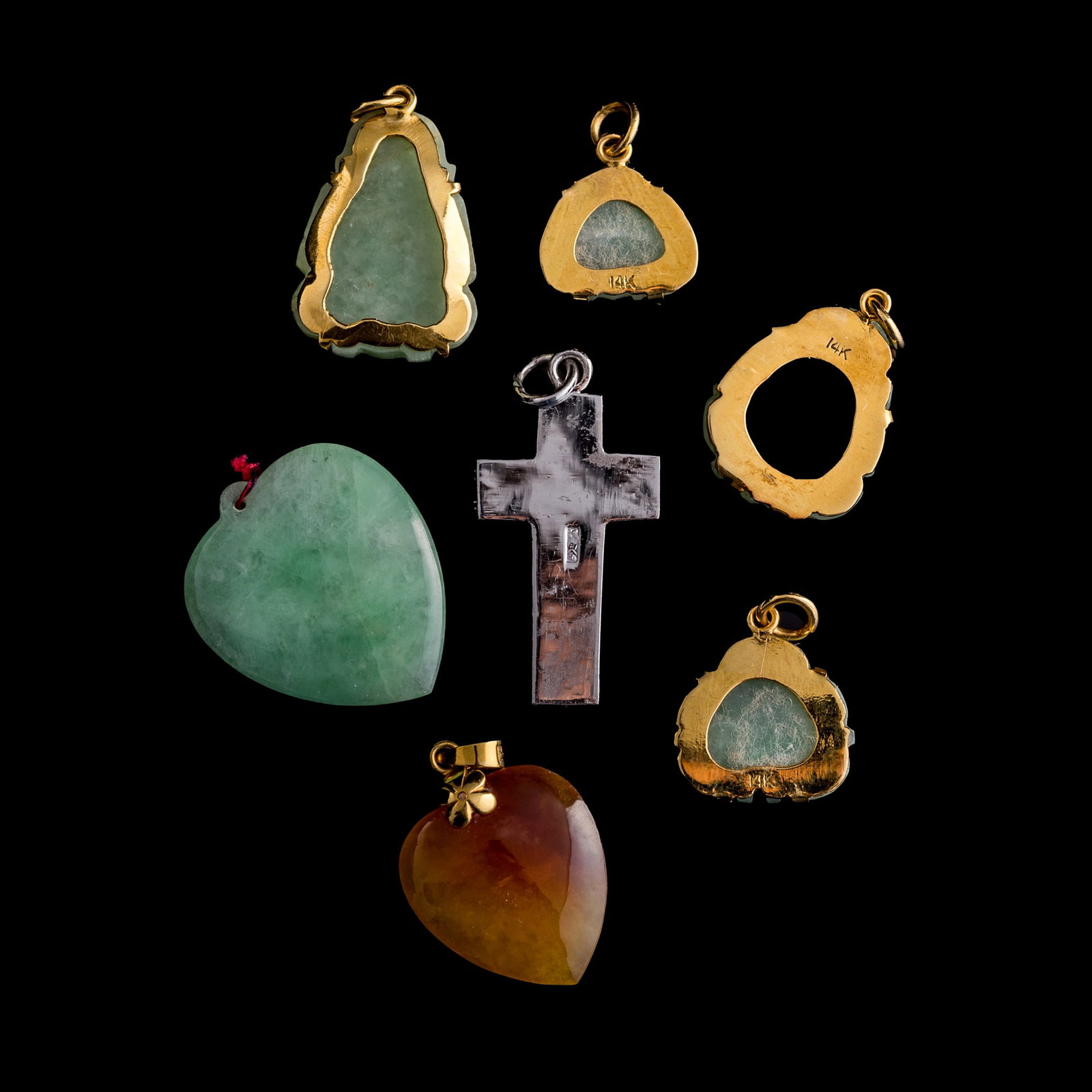 Seven assorted jadeite pendants - 2