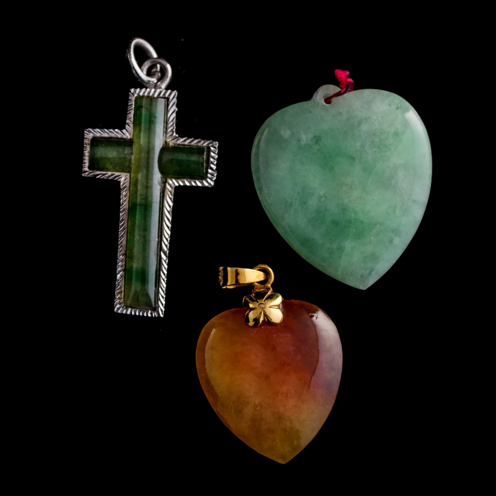 Seven assorted jadeite pendants - 3