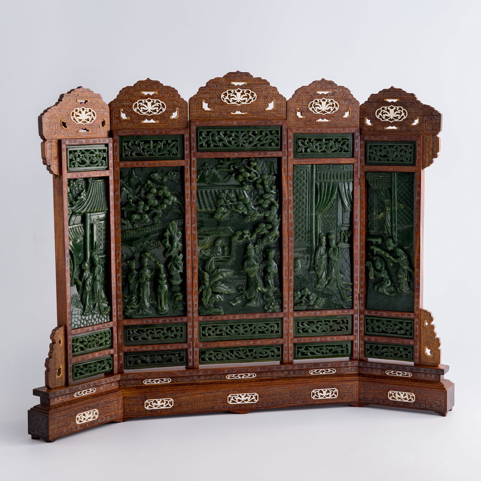 A five-panel Chinese hardwood table screen inset with spinach jade plaques, 1950s-1970s (1 of 11)