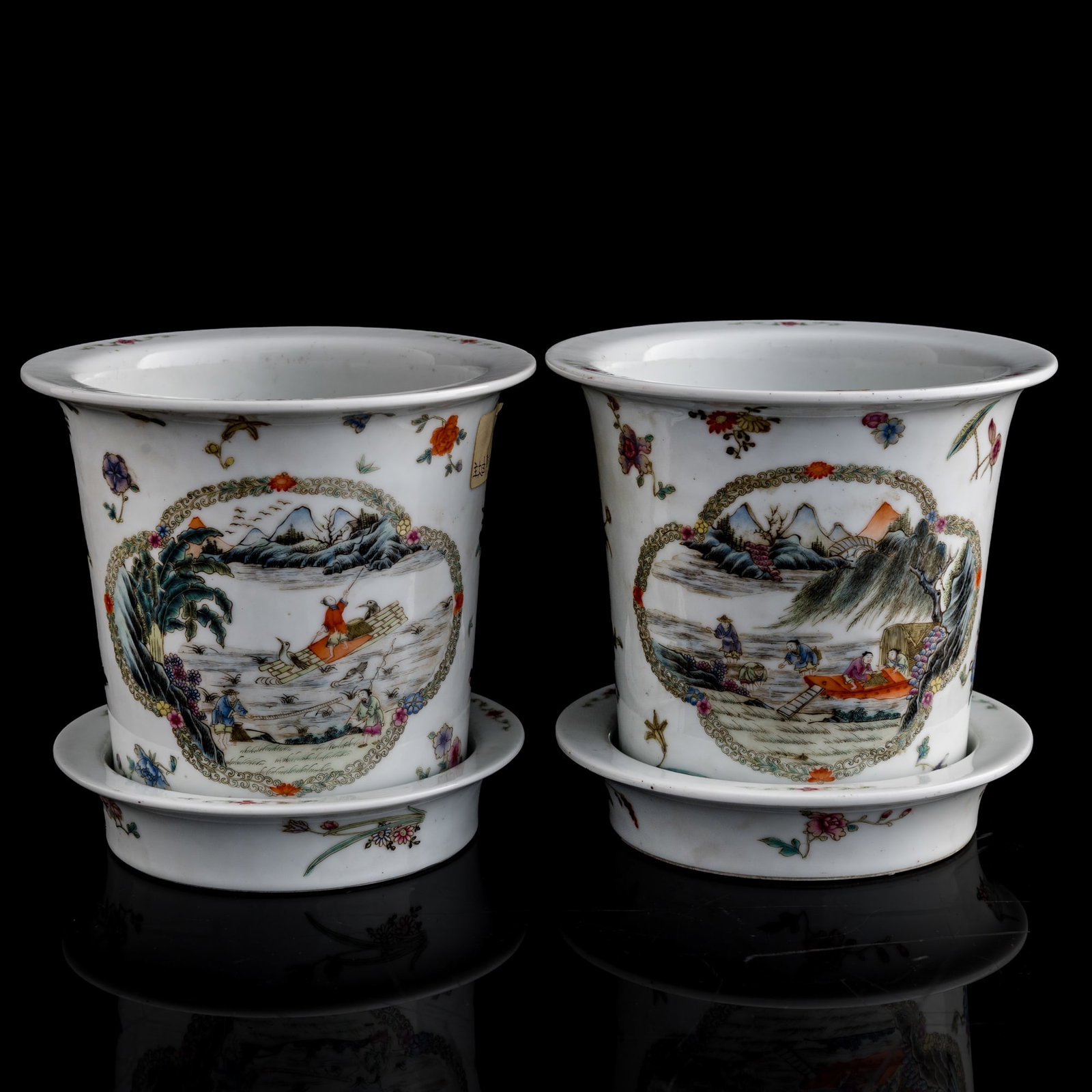 A pair of Chinese famille rose 'landscape' jardinieres, Republic period: A pair of Chinese famille rose 'landscape' jardinieres Republic period Each with a six-character mark to the underside of both the pot and tray. Sold with a fitted brocade box. (2). H: 6 5/8, Dia: 7 i
