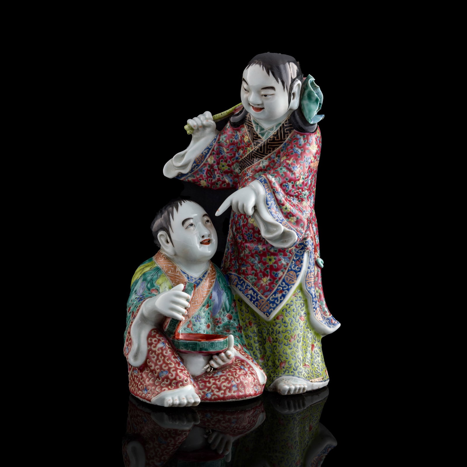 A Chinese famille rose figure of Hehe Erxian, Republic period: A Chinese famille rose figure of Hehe Erxian Republic period With "Wei Hongtai zao" mark to underside. Sold with a brocade box. H: 12 7/8, W: 9, D: 6 in. (H: 32.7, W: 22.9, D: 15.2 cm.) From Mrs. Chan