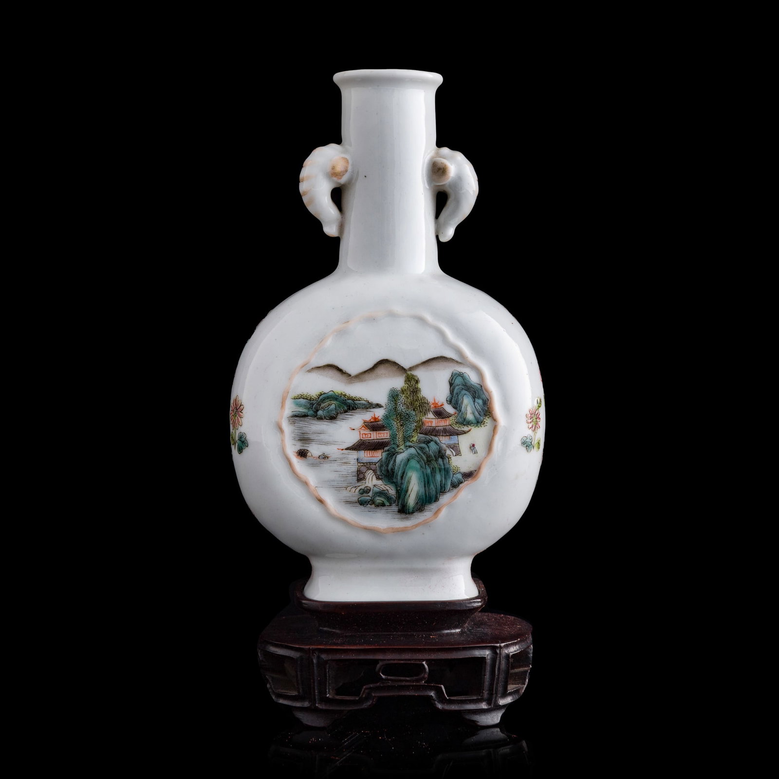 A Chinese famille rose 'landscape' elephant-handled vase, Republic period: A Chinese famille rose 'landscape' elephant-handled vase Republic period Sold with old brocade box and hardwood stand. H: 7 1/8, W: 4 1/4, D: 2 1/4 in. (H: 18.1, W: 10.8, D: 5.7 cm. (vase)) From Mr. S