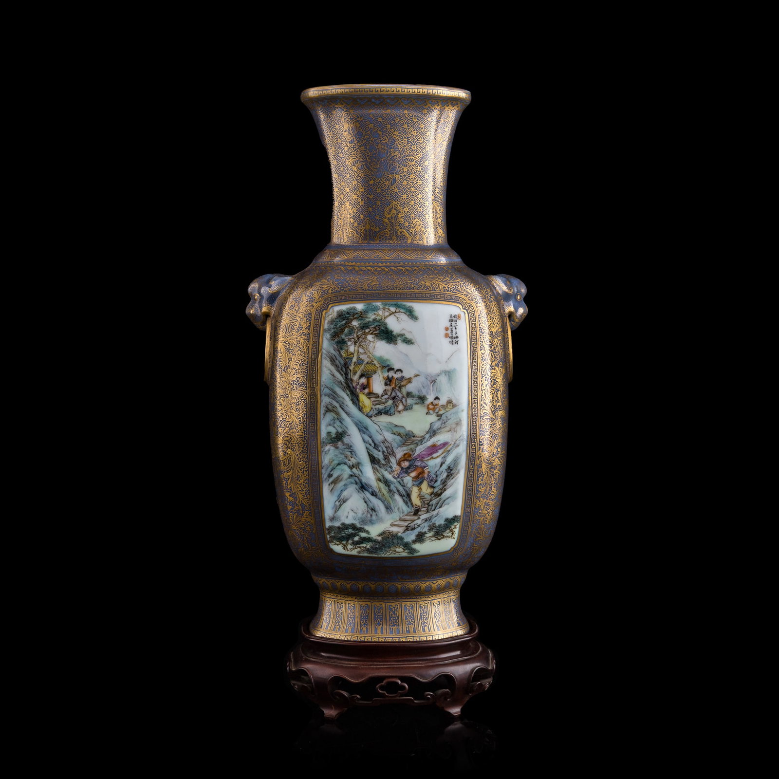 A Chinese gilt-decorated blue-ground famille rose vase, Republic period: A Chinese gilt-decorated blue-ground famille rose vase Republic period With six-character mark to underside. Sold with an old brocade-lined pewter box and a hardwood stand. H: 12 5/8, W: 6 1/2, D: 4 5