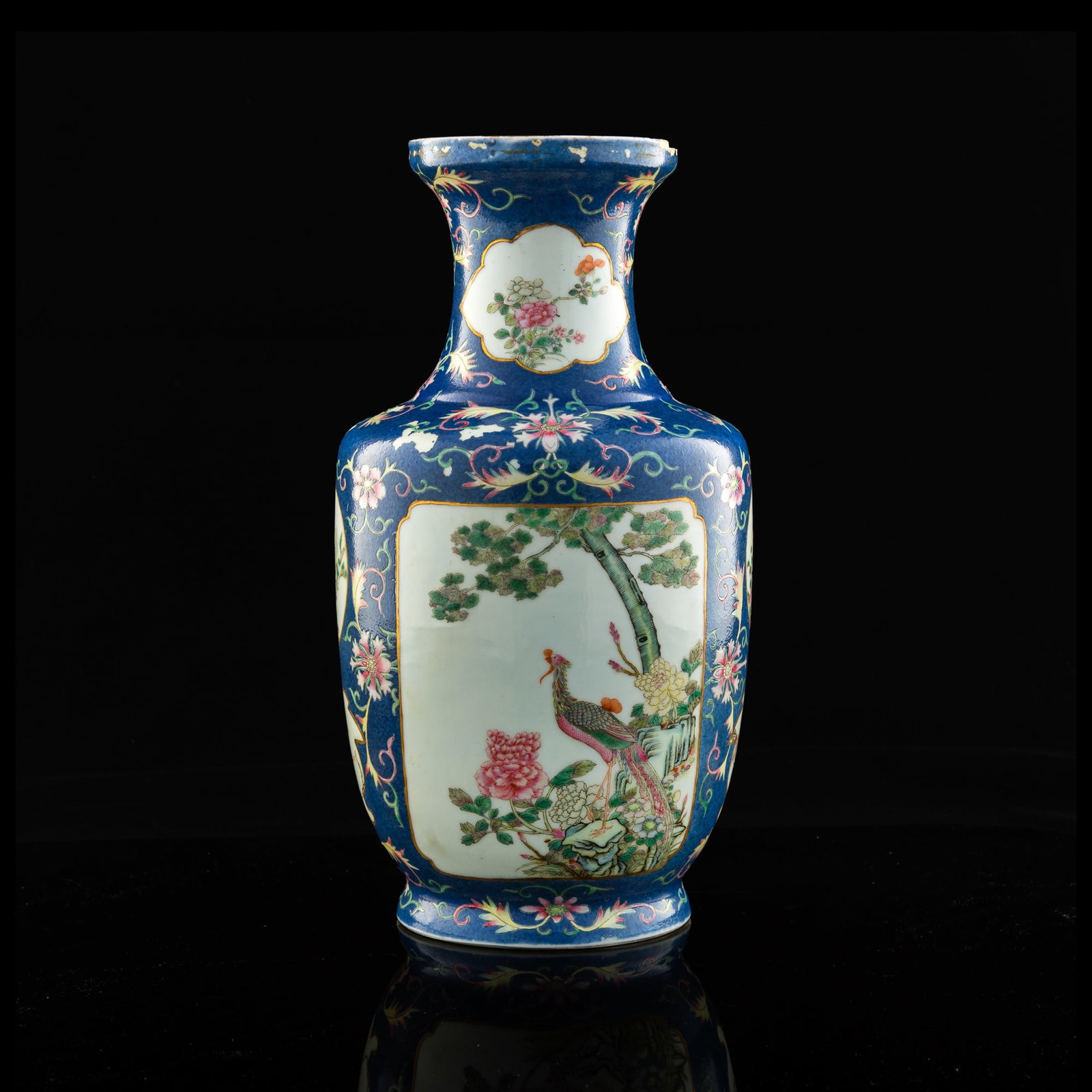 A Chinese blue-ground famille rose 'flower and bird' vase, possibly Qianlong period, Qing dynasty: A Chinese blue-ground famille rose 'flower and bird' vase possibly Qianlong period, Qing dynasty Featuring medallions and vignettes of blooming polychrome flowers and peaceful birds among a scrolling 