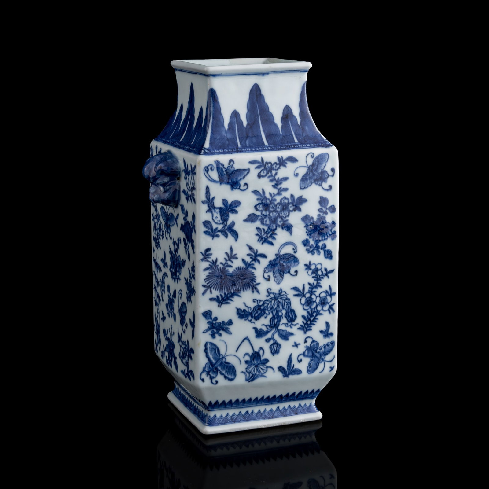 A Chinese blue and white 'flower' and 'butterfly' handled vase, early 19th century: A Chinese blue and white 'flower' and 'butterfly' handled vase early 19th century H: 11 7/8, W: 6 5/8, D: 4 3/4 in. (H: 30.2, W: 16.8, D: 12.1 cm.) Private collection, New York.