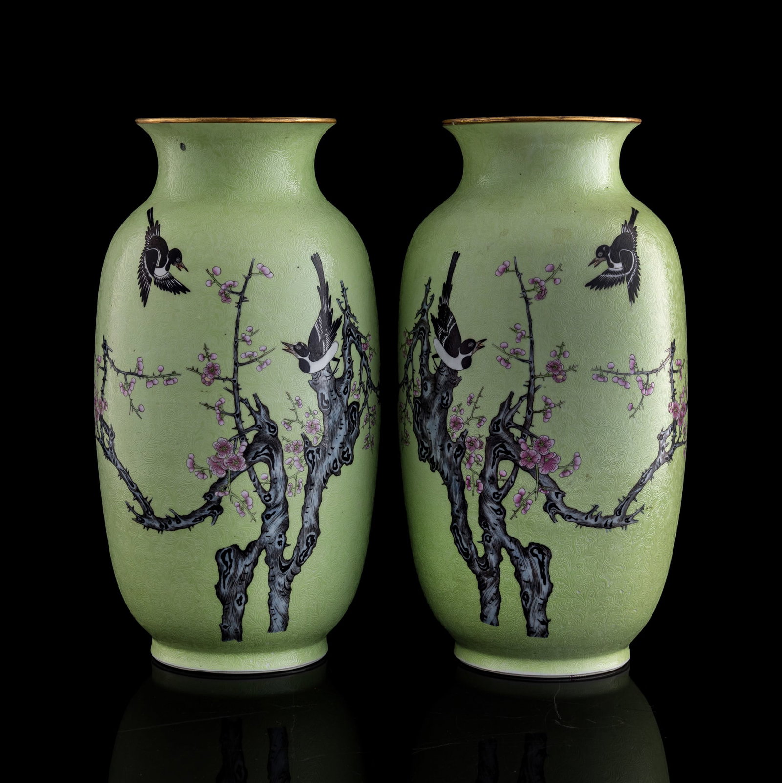 A pair of Chinese green-ground 'magpie and prunus' famille rose vases, Republic period: A pair of Chinese green-ground 'magpie and prunus' famille rose vases Republic period Each with six-character mark to underside. (2). H: 15 3/4. Dia: 7 7/8 in. (H: 40, Dia: 20 cm. (each)) Private esta