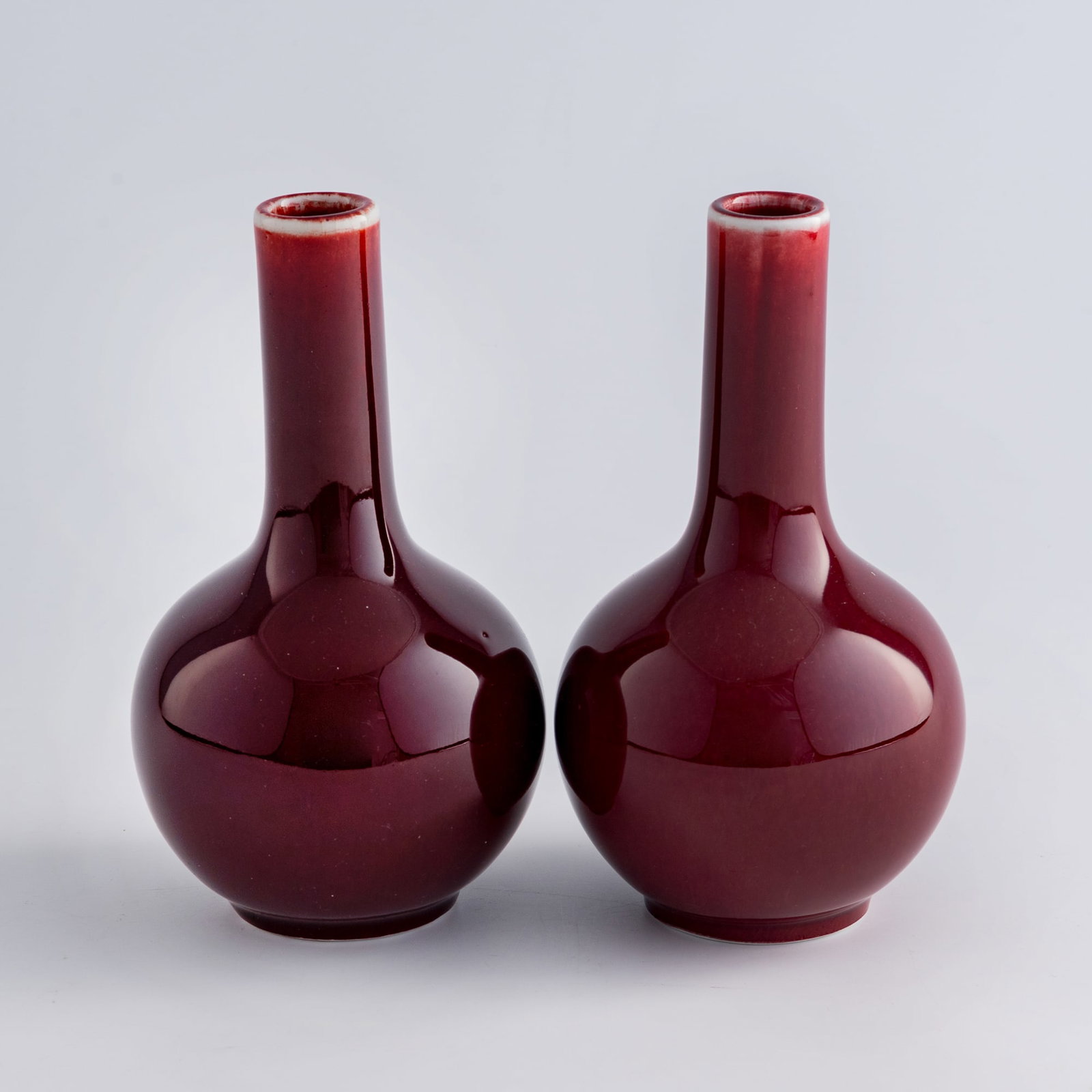 A pair of Chinese red-glazed tianqiu vases, 1960s-1970s (1 of 10)