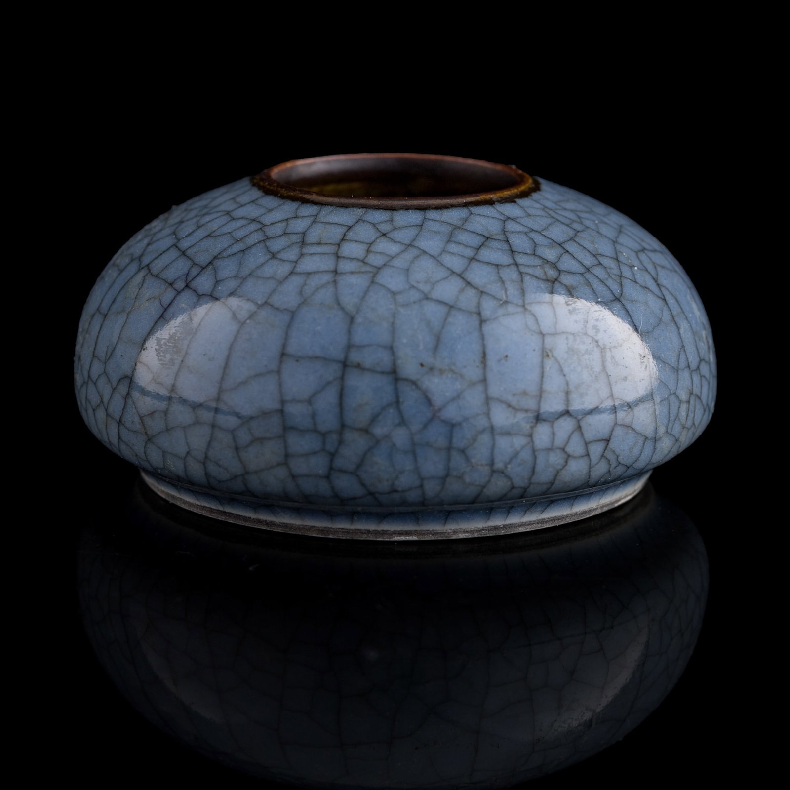 A Chinese blue-ground ge-type glazed water coupe, 19th century: A Chinese blue-ground ge-type glazed water coupe 19th century Sold with a brocade box. H: 1 1/2, Dia: 3 in. (H: 3.8, Dia: 7.6 cm.) From Mrs. Chan in Saratoga, California; inherited from her father Dav