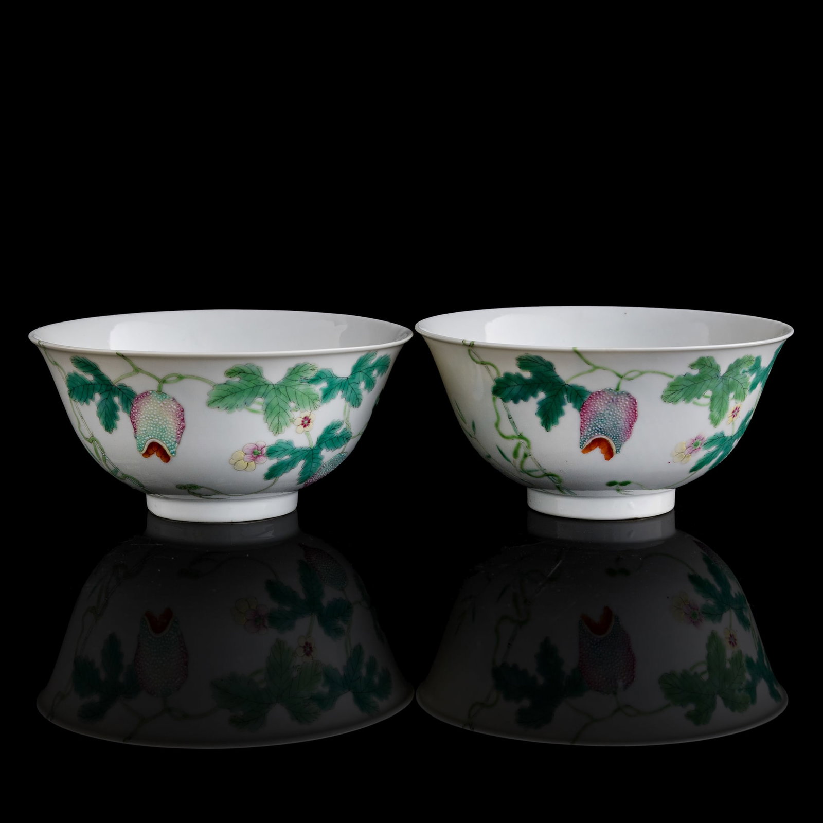 A pair of Chinese famille rose 'melon' bowls, Daoguang period, Qing dynasty: A pair of Chinese famille rose 'melon' bowls Daoguang period, Qing dynasty Each finely decorated with leafy bitter-melon vines and butterflies. Each with "Le Gu Tang zhi" mark to underside. Sold with 