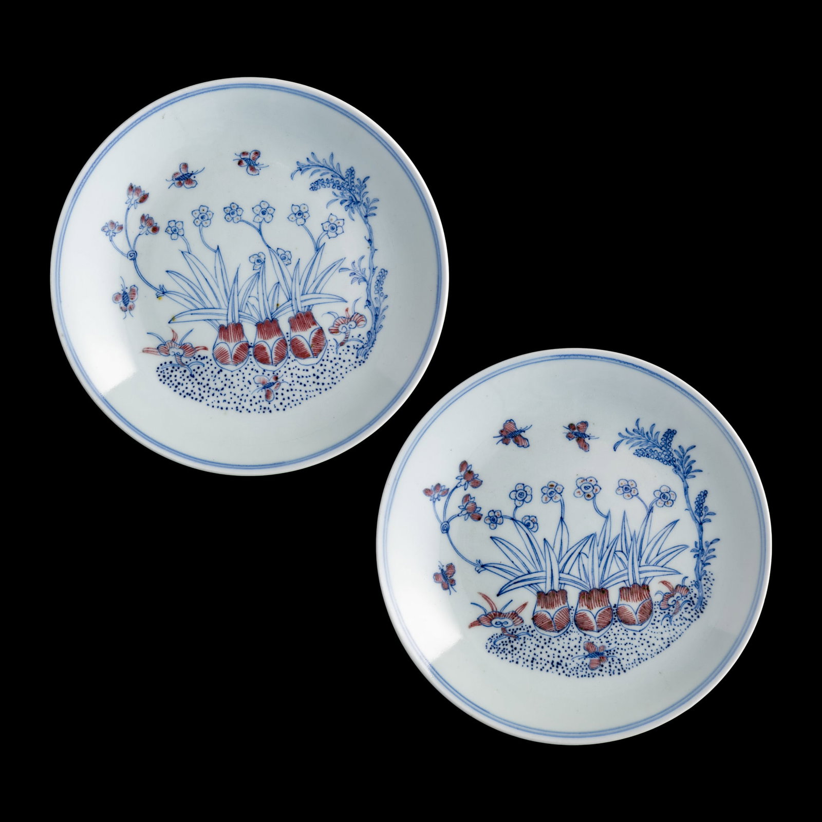 A pair of Chinese blue and copper-red-underglazed 'flower and butterfly' dishes, Jiaqing period,: A pair of Chinese blue and copper-red-underglazed 'flower and butterfly' dishes Jiaqing period, Qing dynasty Each with six-character Jiaqing mark to underside. Sold with a fitted brocade box. (2). H: 