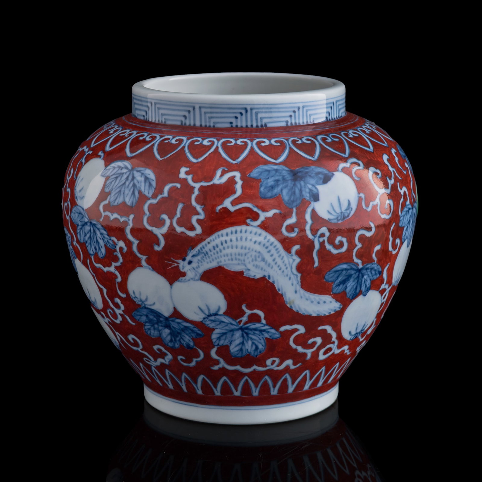 A Chinese iron-red and blue jar, Qing dynasty (1 of 9)