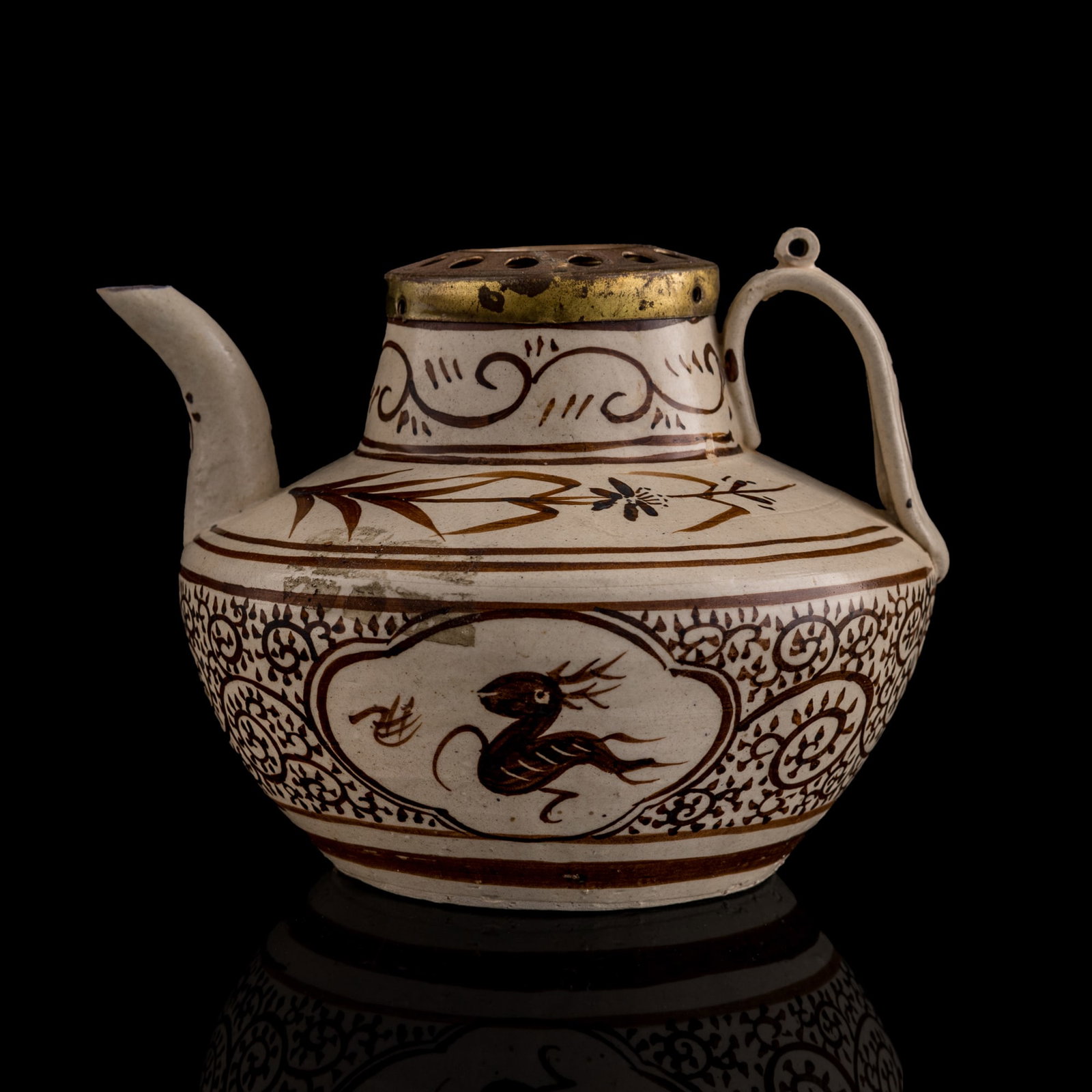 A Chinese Cizhou white-ground brown-painted 'orchid' teapot, Ming dynasty: A Chinese Cizhou white-ground brown-painted 'orchid' teapot Ming dynasty H: 4 3/4, W: 6 1/4, D: 5 1/2 in. (H: 12.1, W: 15.9, D: 14 cm.) Private collection, Ashburn, Virginia.
