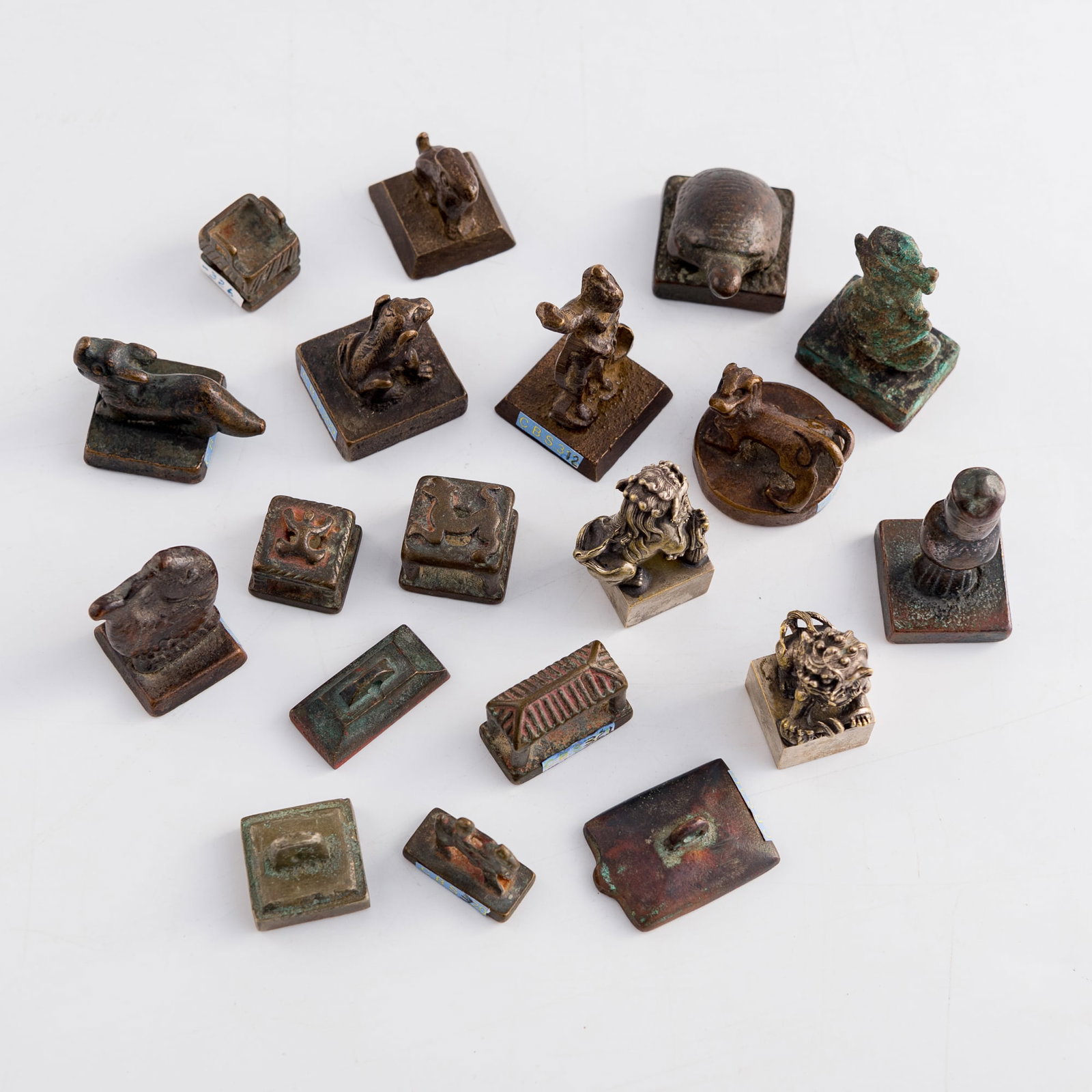 Nineteen assorted Chinese bronze seals, Ming/Qing dynasty: Nineteen assorted Chinese bronze seals Ming/Qing dynasty Seventeen with a variety of characters and pictorial markings to undersides. (19). H: 2, W: 1, D: 1 in. (H: 5.1, W: 2.5, D: 2.5 cm. (tallest)) 