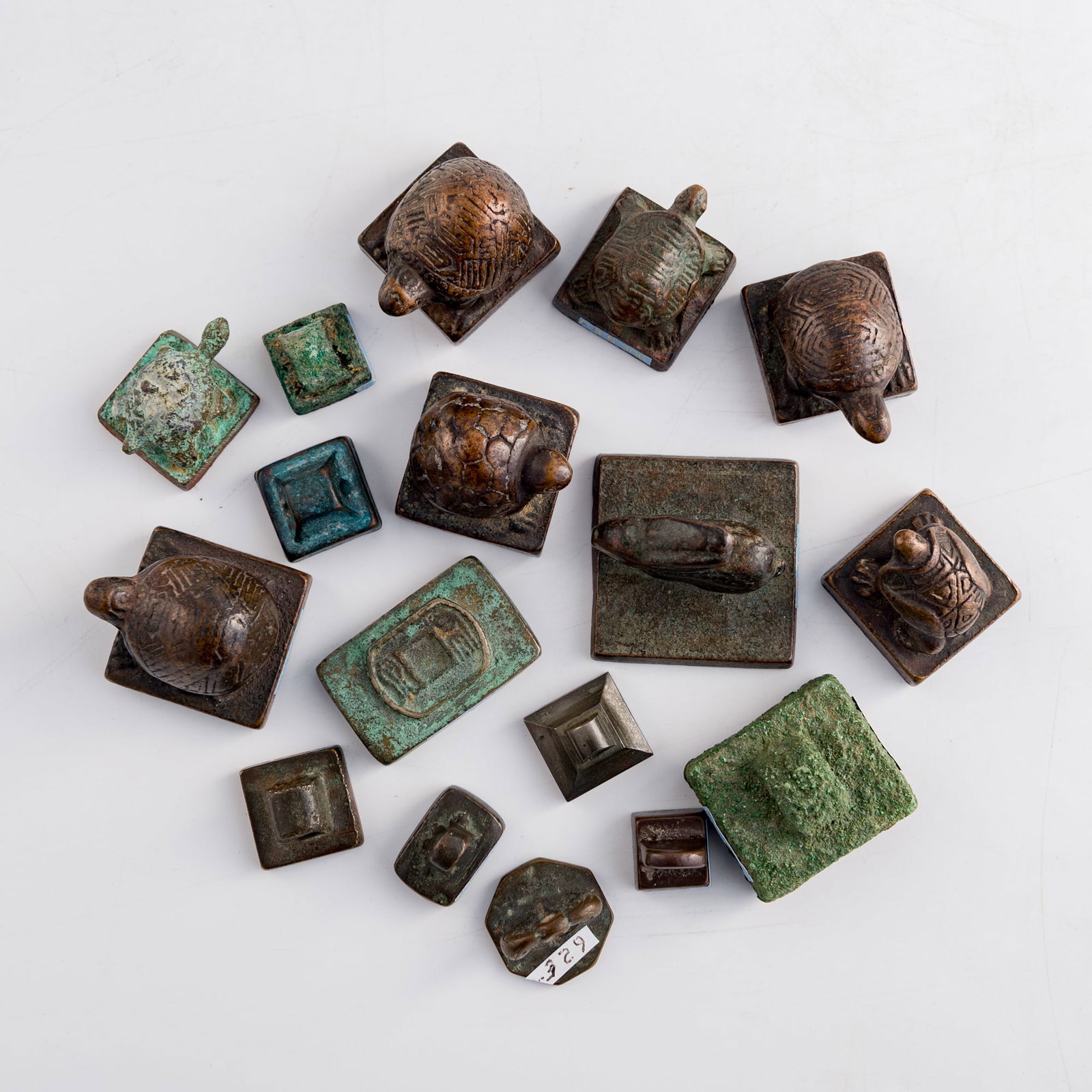 Seventeen assorted Chinese bronze seals, Ming/Qing dynasty: Seventeen assorted Chinese bronze seals Ming/Qing dynasty Each with varying numbers of characters, pictorial decorations, or both to underside. (17). H 1 3/8, W: 1 5/8, D: 1 5/8 in. (H: 3.5, W: 4.1, D