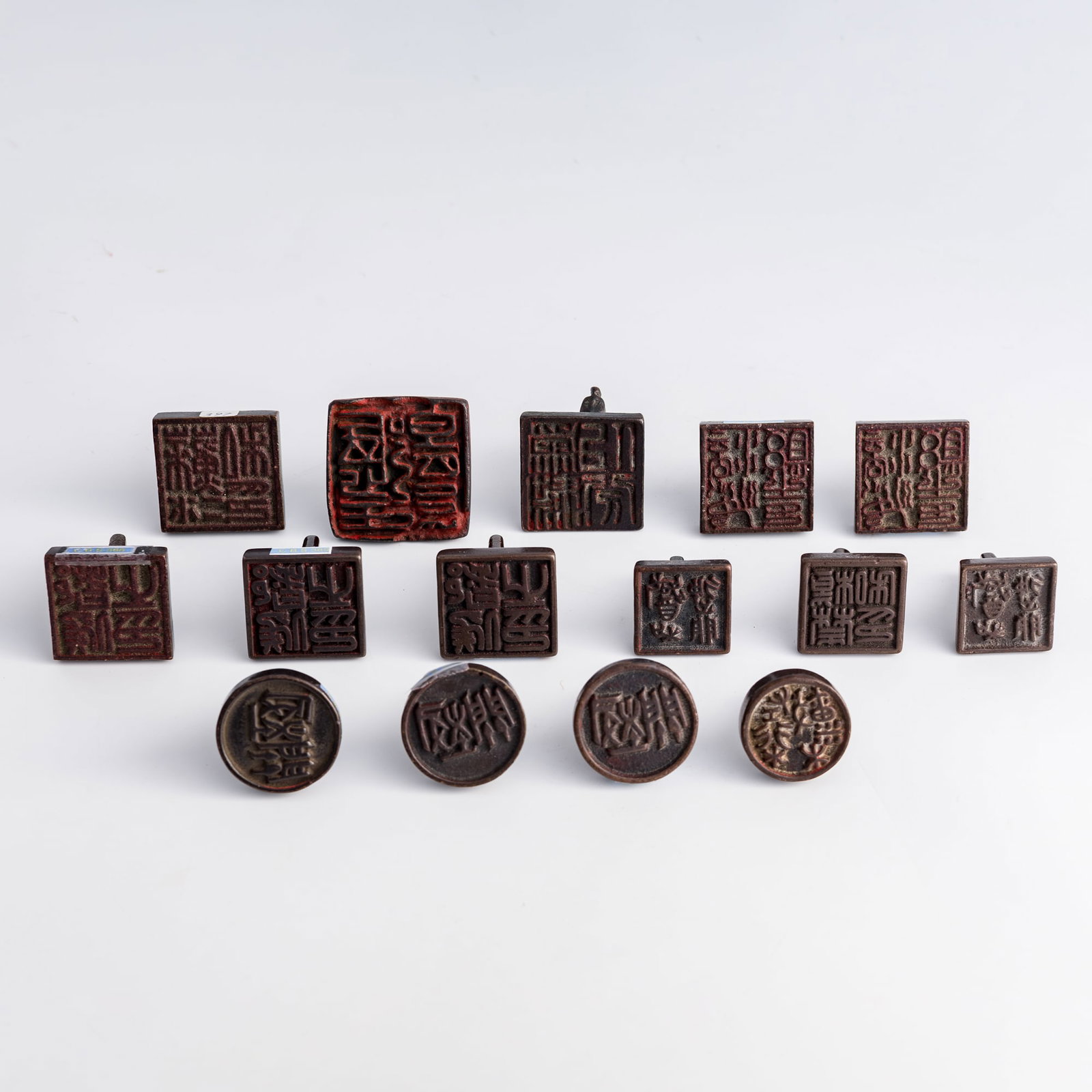 Fifteen Chinese copper-alloy seals, Ming/Qing dynasty: Fifteen Chinese copper-alloy seals Ming/Qing dynasty All with character marks to undersides. (15). H: 1 1/2, W: 1 7/8, D: 1 7/8 in. (H: 3.8, W: 4.8, D: 4.8 cm. (largest)) Weight: 1622.7 g (overall) Pr