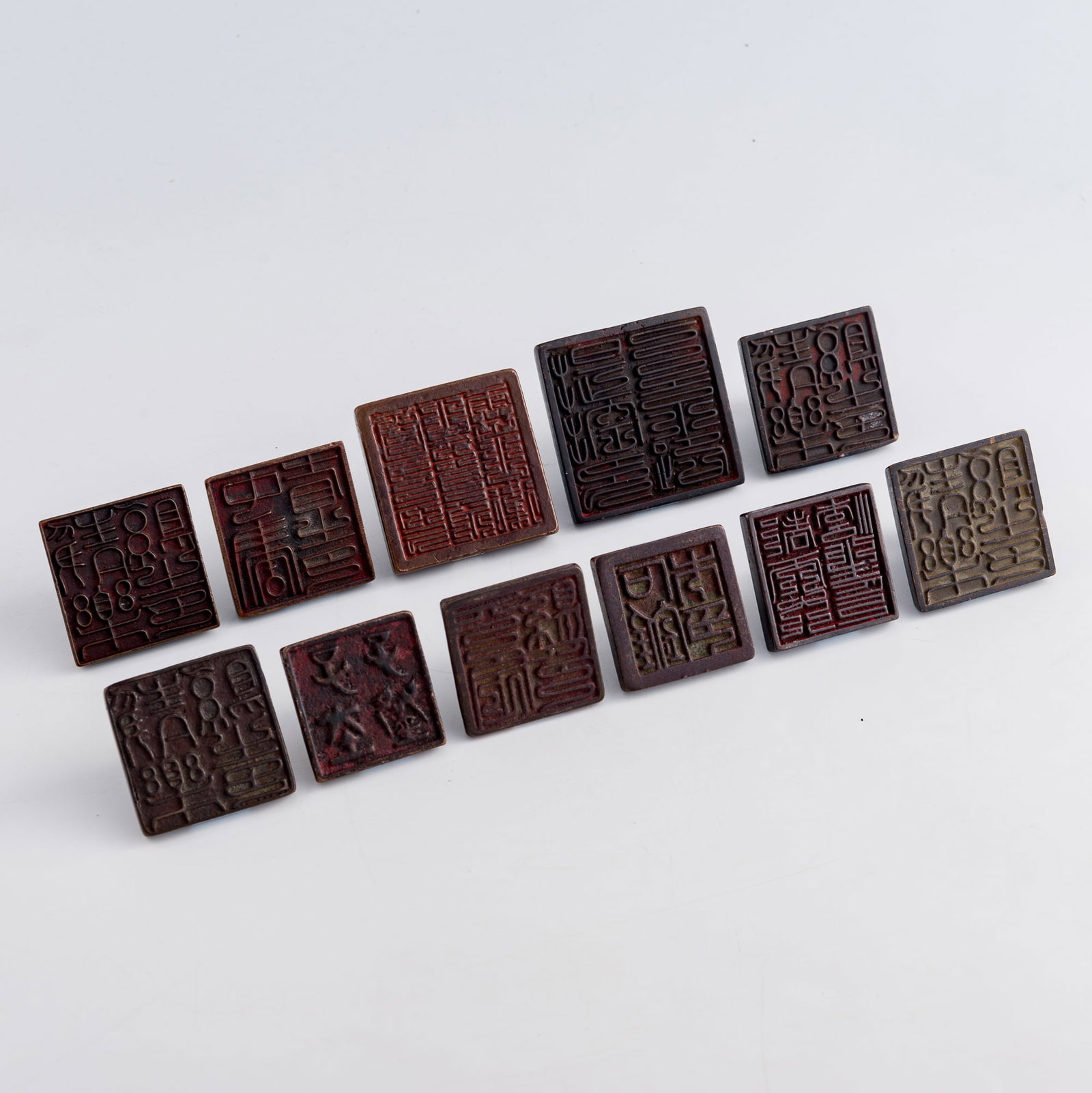 Eleven Chinese bronze seals with nose-form finials, Ming/Qing dynasty: Eleven Chinese bronze seals with nose-form finials Ming/Qing dynasty H: 2, W: 2 3/4, D: 2 3/4 in. (H: 5.1, W: 7, D: 7 cm. (largest)) Weight: 3169.4 g (overall) Private collection, Charlottesville, Vir
