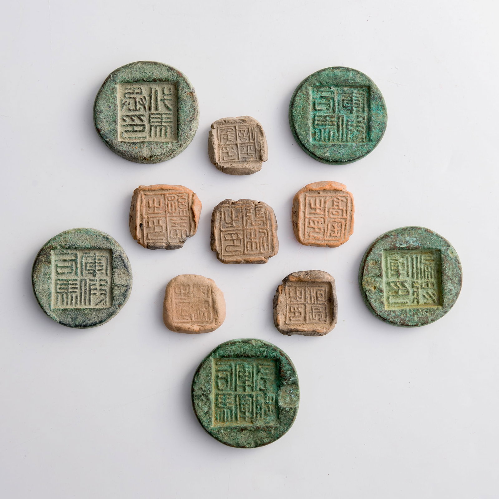 A group of Chinese pottery stamps and bronze seal moulds, Han dynasty or later (1 of 7)