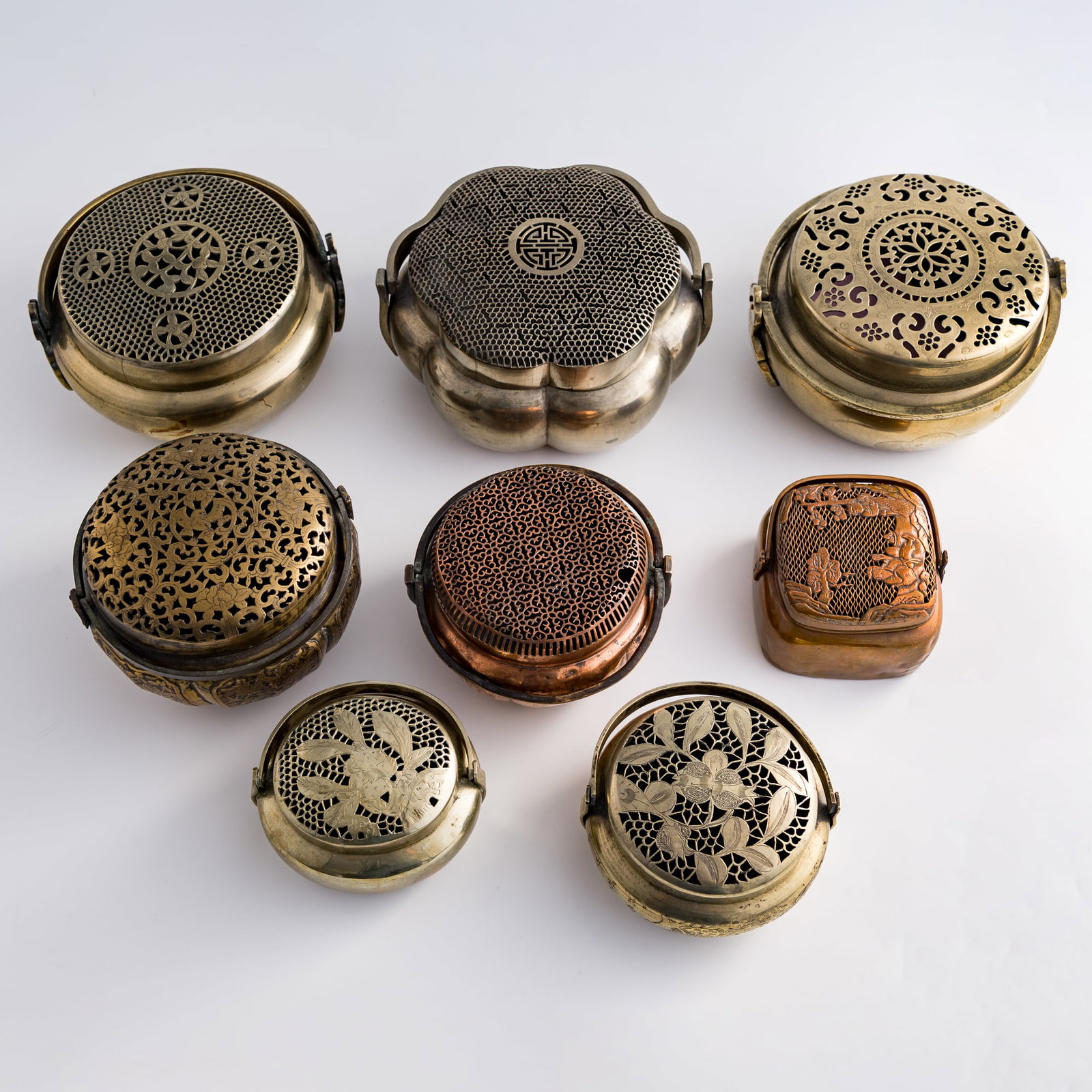 Eight Chinese copper-alloy hand warmers, Qing dynasty/Republic period (1 of 10)
