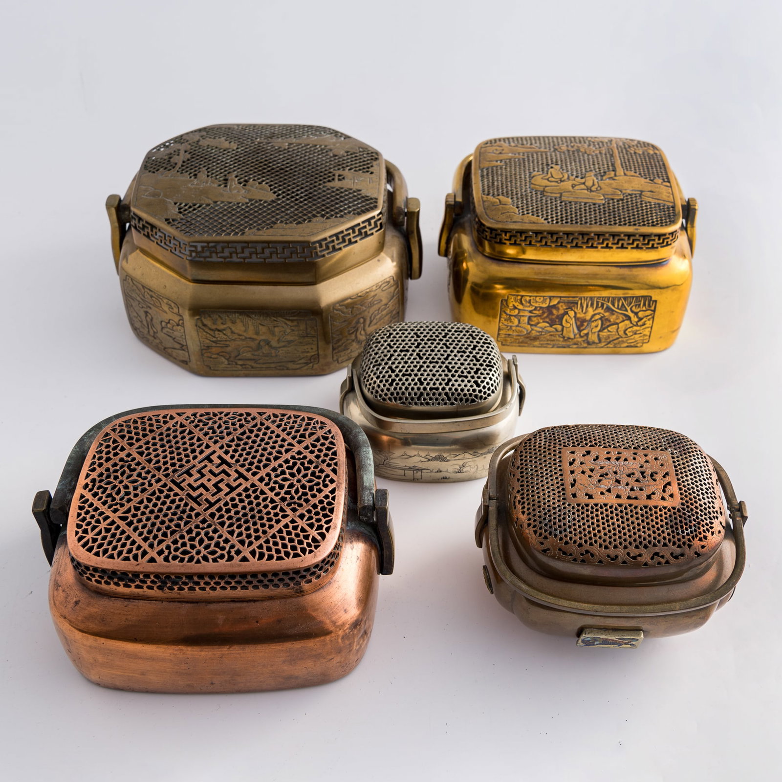 Five Chinese copper-alloy hand warmers, 19th century: Five Chinese copper-alloy hand warmers 19th century H: 5 1/2, W: 9 1/2, D: 7 3/4 in. (H: 14, W: 24.1, D: 19.7 cm. (largest)) Weight: 6200 g (overall) Private collection, Charlottesville, Virginia.