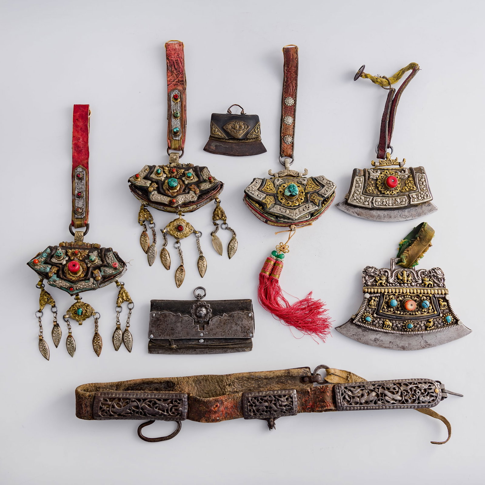 A group of Tibetan fire strikers and iron-mounted horse harness, 18th/19th century: A group of Tibetan fire strikers and iron-mounted horse harness 18th/19th century Comprising four fire strikers and four iron-mounted horse harness pieces. (8). H: 4 3/4, W: 7 3/8, D: 1 3/8 in. (H:
