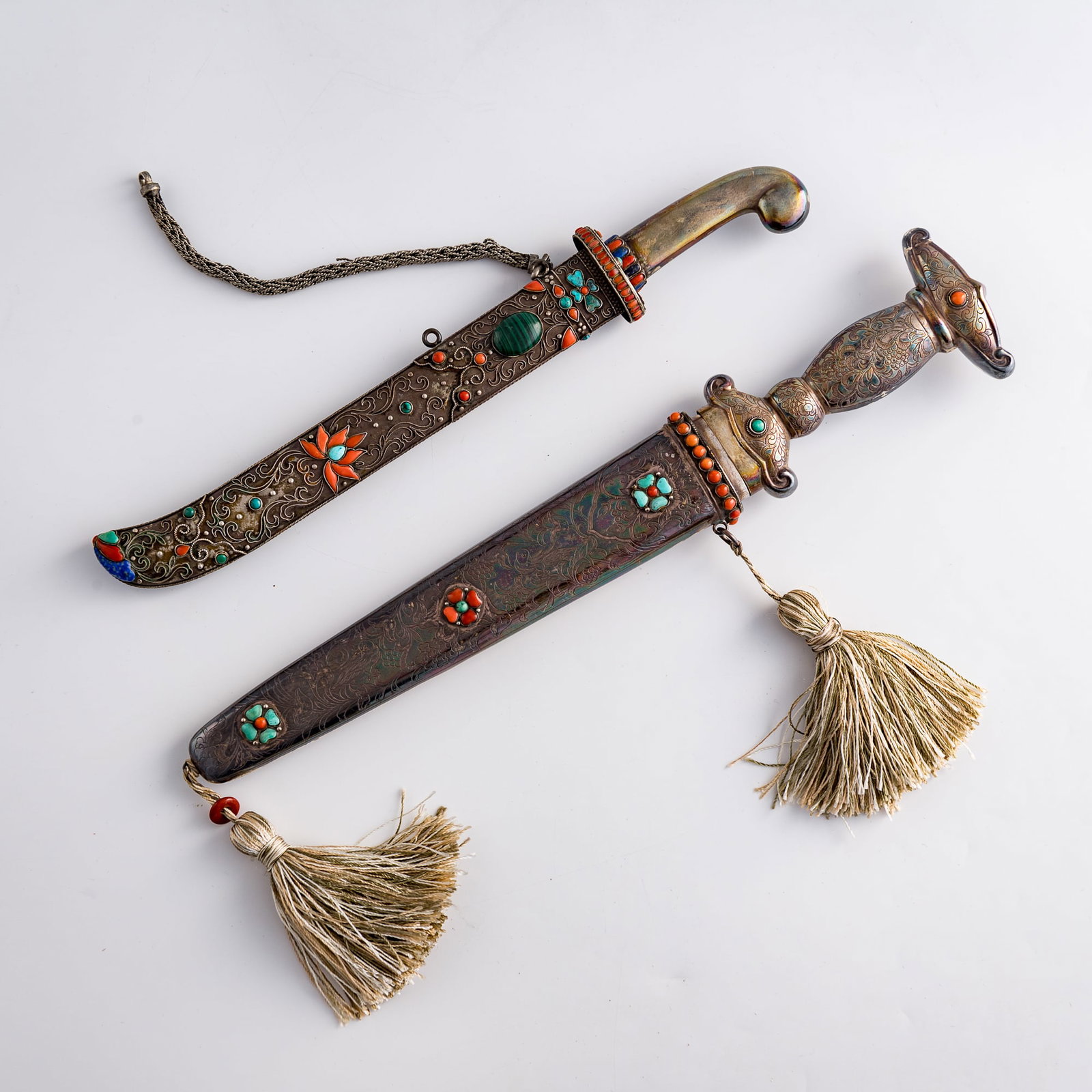 Two Mongolian knives, Qing dynasty/Republic period: Two Mongolian knives Qing dynasty/Republic period L: 14, W: 2 3/4, D: 1 1/8 in. (L: 35.6, W: 7, D: 2.9 cm. (largest)) Weight: 712.6 g (overall) Private collection, Charlottesville, Virginia. Click