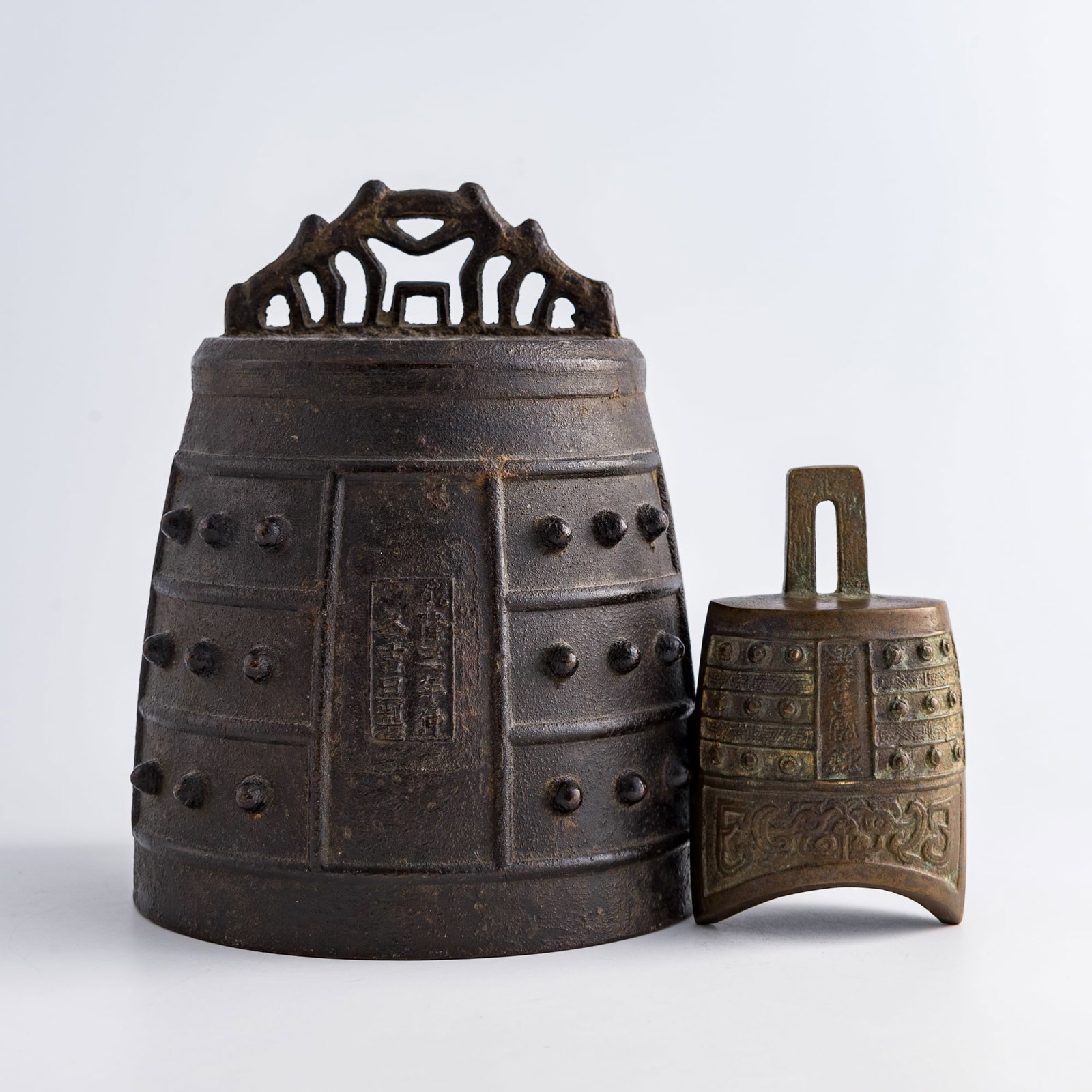Two Chinese bronze bianzhong bells, Qing dynasty: Two Chinese bronze bianzhong bells Qing dynasty Largest with one seven-character mark and one nine-character mark, smallest with two four-character marks. (2). H: 8 1/2, Dia: 6 3/4 in. (H: 21.6, Dia: