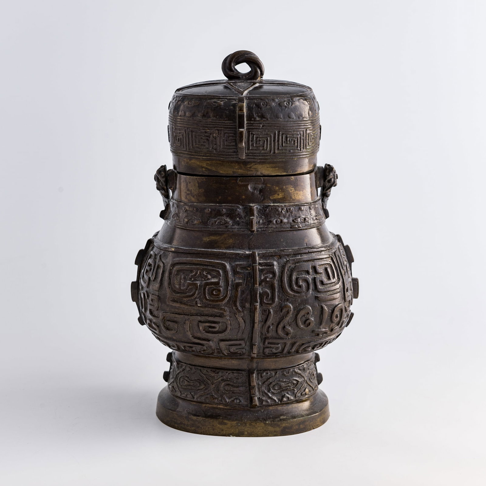 A Chinese bronze handled you vessel, Ming dynasty (1 of 9)