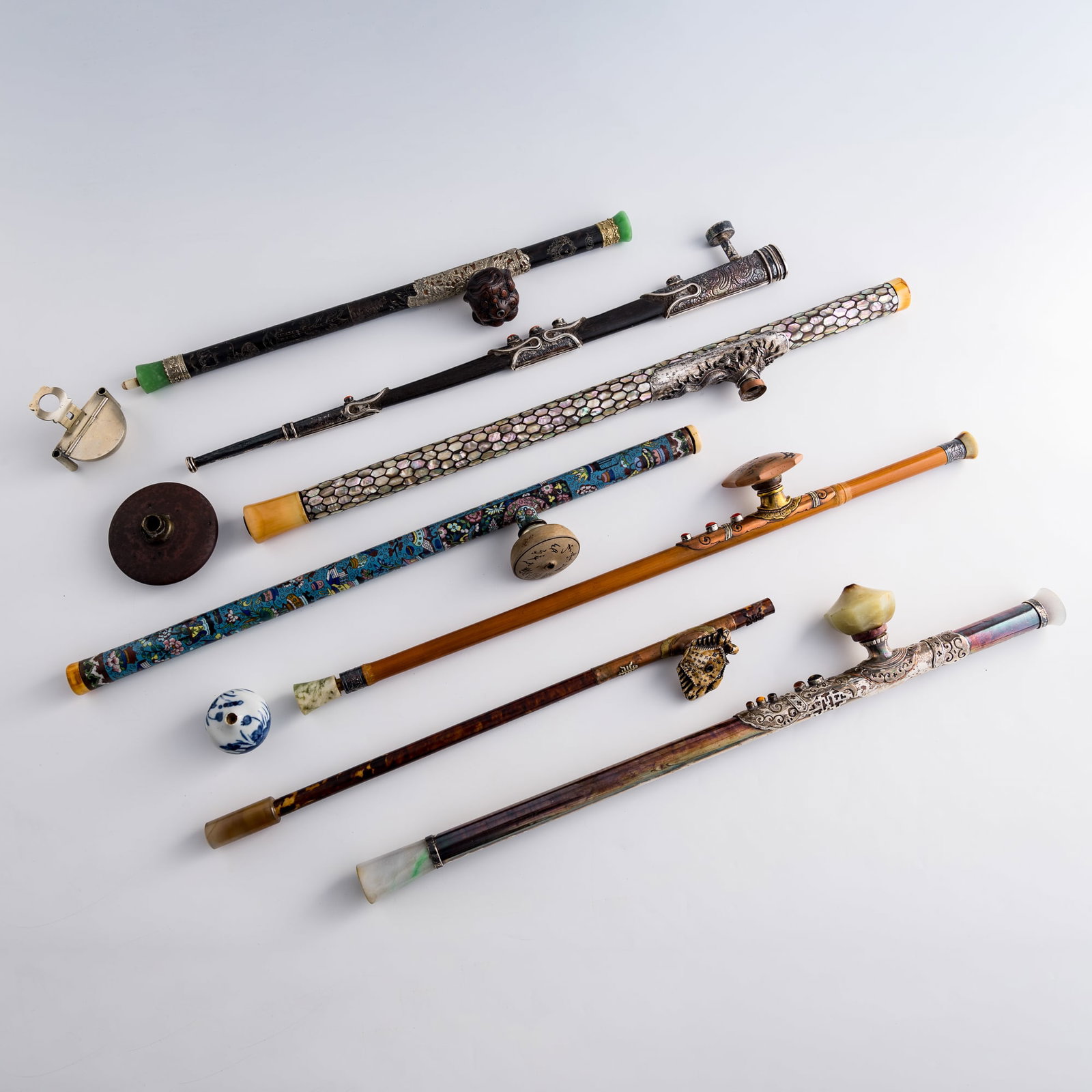 Seven Chinese opium pipes and three pipe bowls, Qing dynasty/Republic period: Seven Chinese opium pipes and three pipe bowls Qing dynasty/Republic period L: 24 1/2, W: 1 1/4, D: 2 3/8 in. (L: 62.2, W: 3.2, D: 6 cm. (largest)) Private collection, Charlottesville, Virginia.