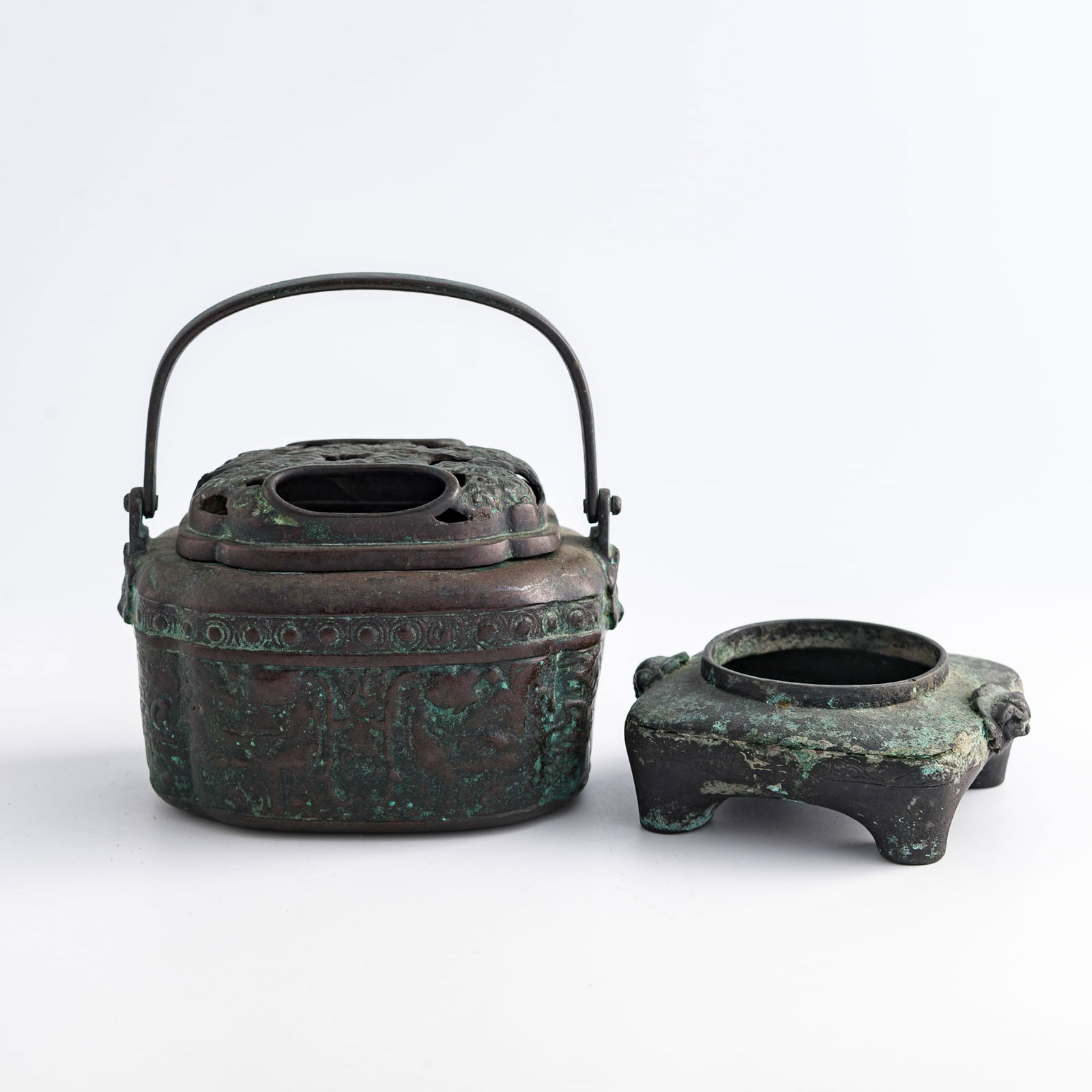 A Chinese bronze hand warmer and a bronze censer, Qing dynasty (1 of 9)