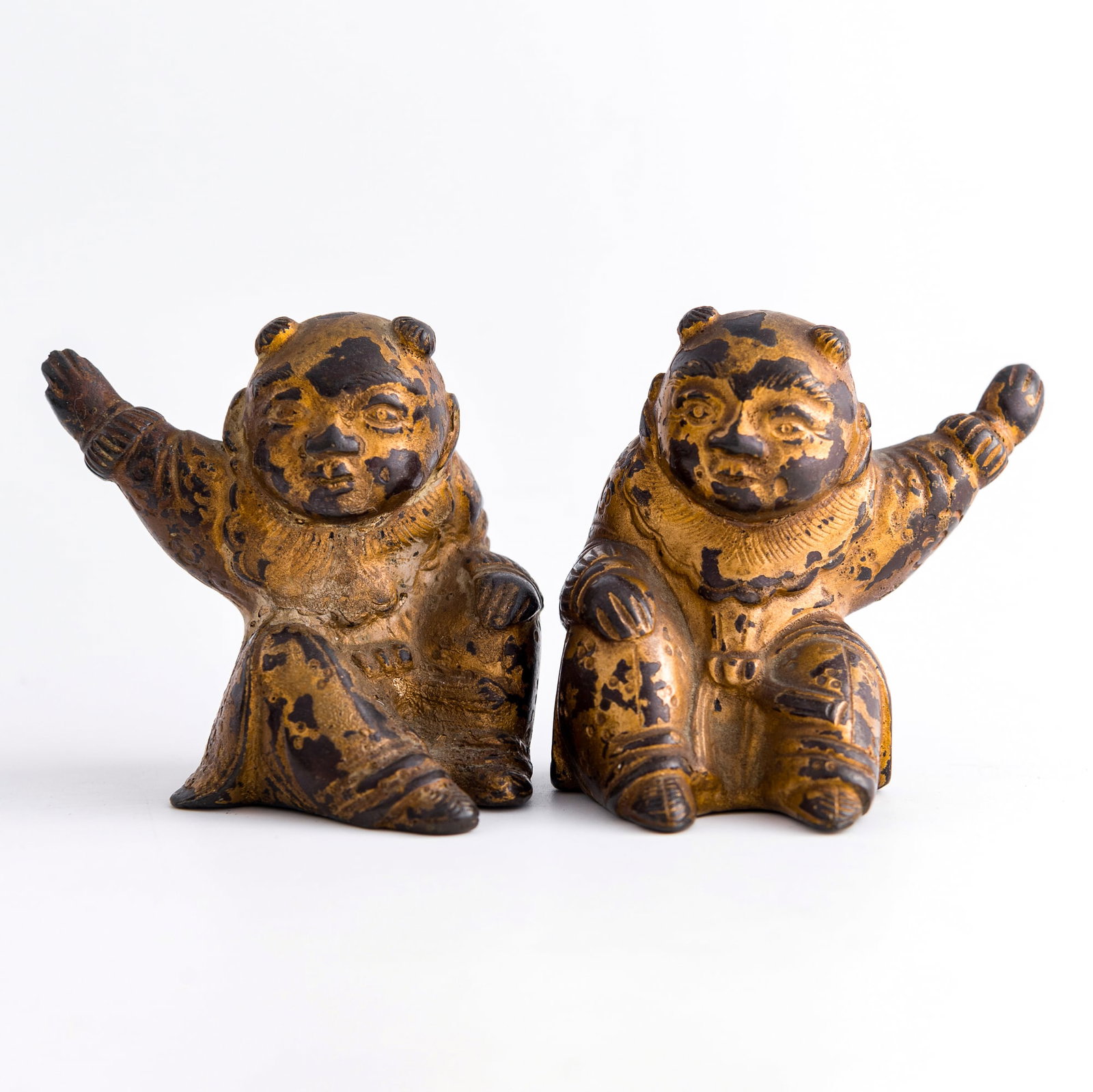 A pair of Chinese gilt-lacquered bronze figures of boys, Ming dynasty: A pair of Chinese gilt-lacquered bronze figures of boys Ming dynasty H: 2 1/2, W: 2 1/4, D: 2 1/4 in. (H: 6.4, W: 5.7, D: 5.7 cm. (largest)) Weight: 554.5 g (overall) From Mrs. Houghton, Huntington Be
