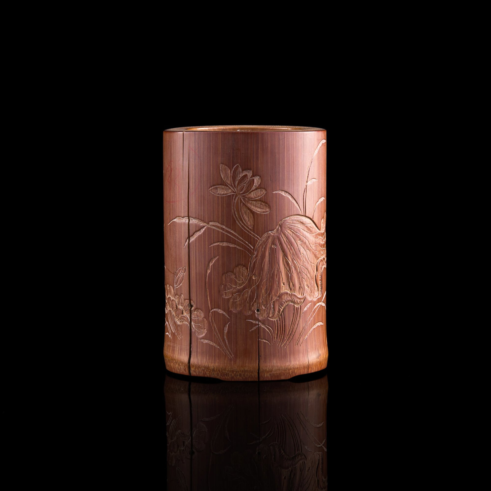 A Chinese bamboo carved 'lotus' brush pot, 18th/19th century: A Chinese bamboo carved 'lotus' brush pot 18th/19th century With previous collection number to interior and underside. H: 4 7/8, Dia: 3 1/4 in. (H: 12.4, Dia: 8.3 cm.) From the estate of Lim Kee Chin,