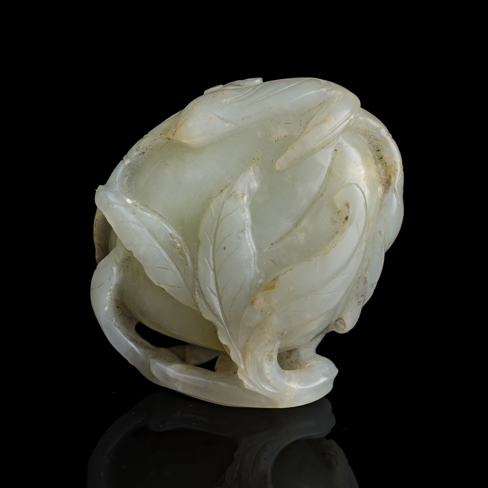 A Chinese white jade peach-form pendant, early 19th century: A Chinese white jade peach-form pendant early 19th century H: 2, W: 1 5/8, D: 1 in. (H: 5.1, W: 4.1, D: 2.5 cm.) Private collection, New York. Click here for high resolution images.