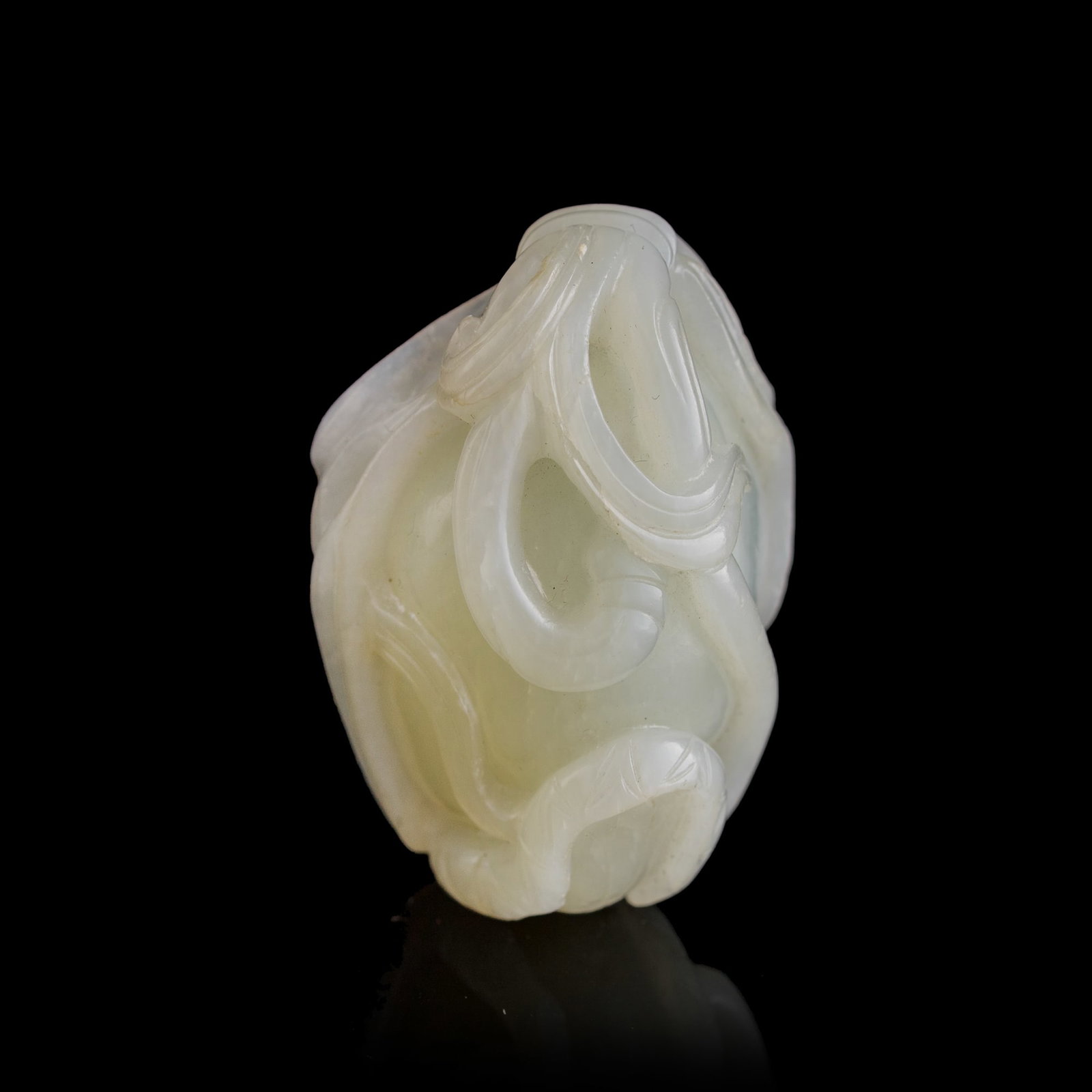 A Chinese white jade lotus pod-form pendant, 18th century: A Chinese white jade lotus pod-form pendant 18th century H: 1 7/8, W: 1 1/4, D: 1 in. (H: 4.8, W: 3.2, D: 2.5 cm.) Private collection, New York. Click here for high resolution images.