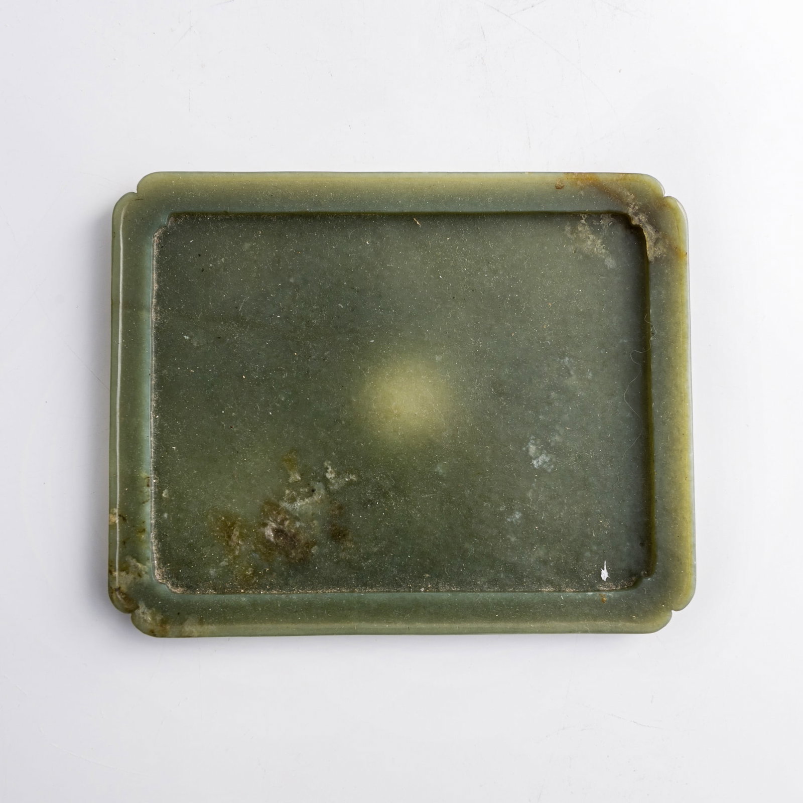 A Chinese carved jade scholar's tray, Ming dynasty: A Chinese carved jade scholar's tray Ming dynasty H: 3/8, W: 7 5/8, D: 6 1/8 in. (H: 1, W: 19.4, D: 15.6 cm.) Private collection, New York. Click here for h