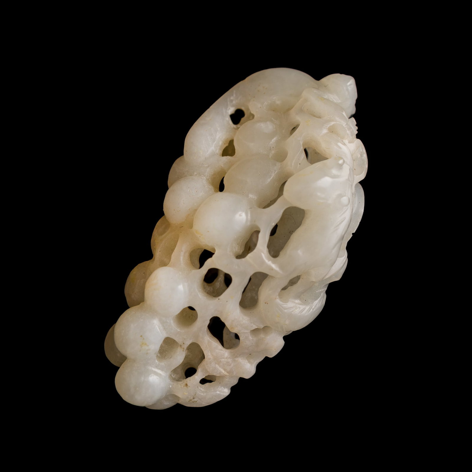 A Chinese white jade 'squirrel and grape' pendant, late 18th century (1 of 7)