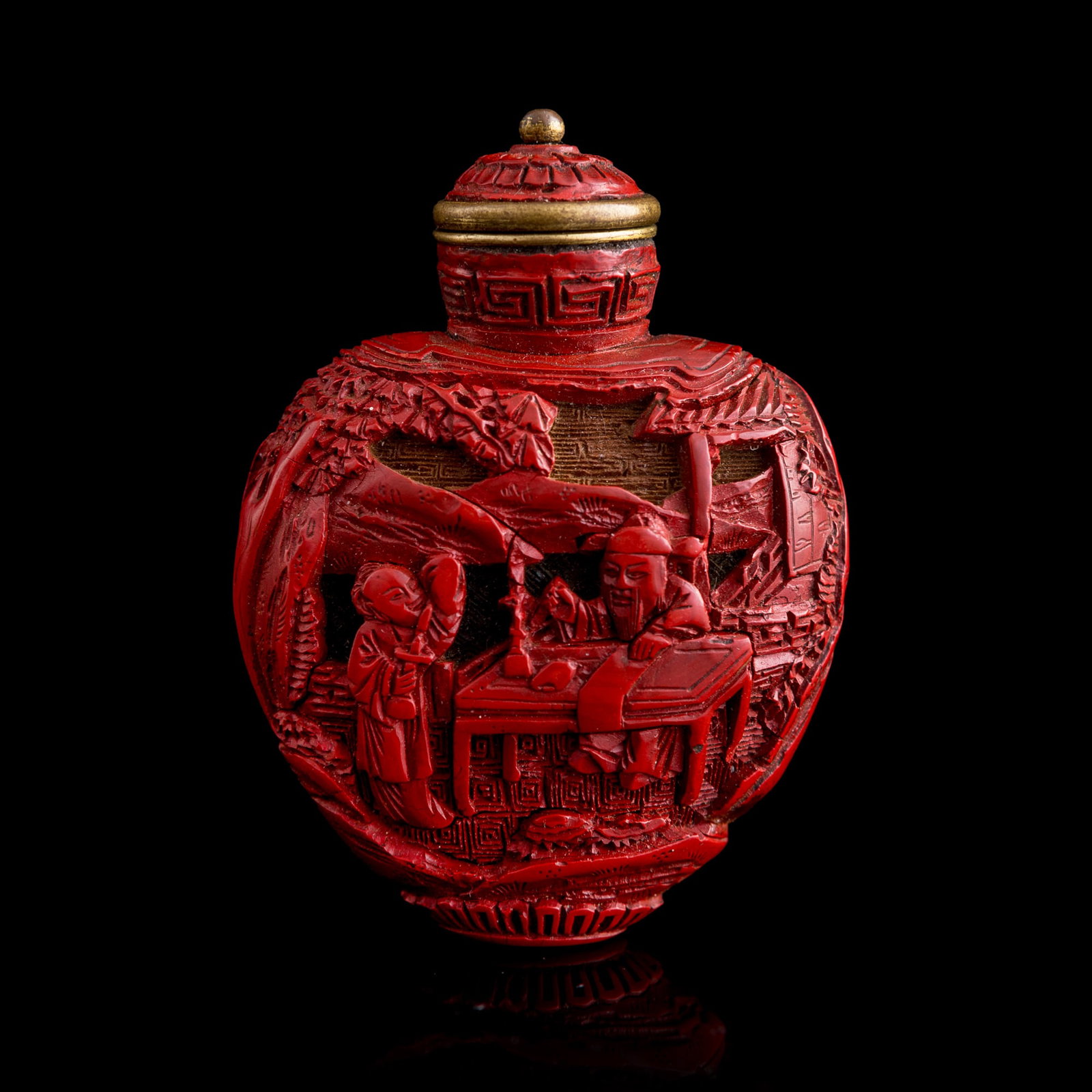 A Chinese cinnabar 'figural' snuff bottle, Qing dynasty (1 of 9)