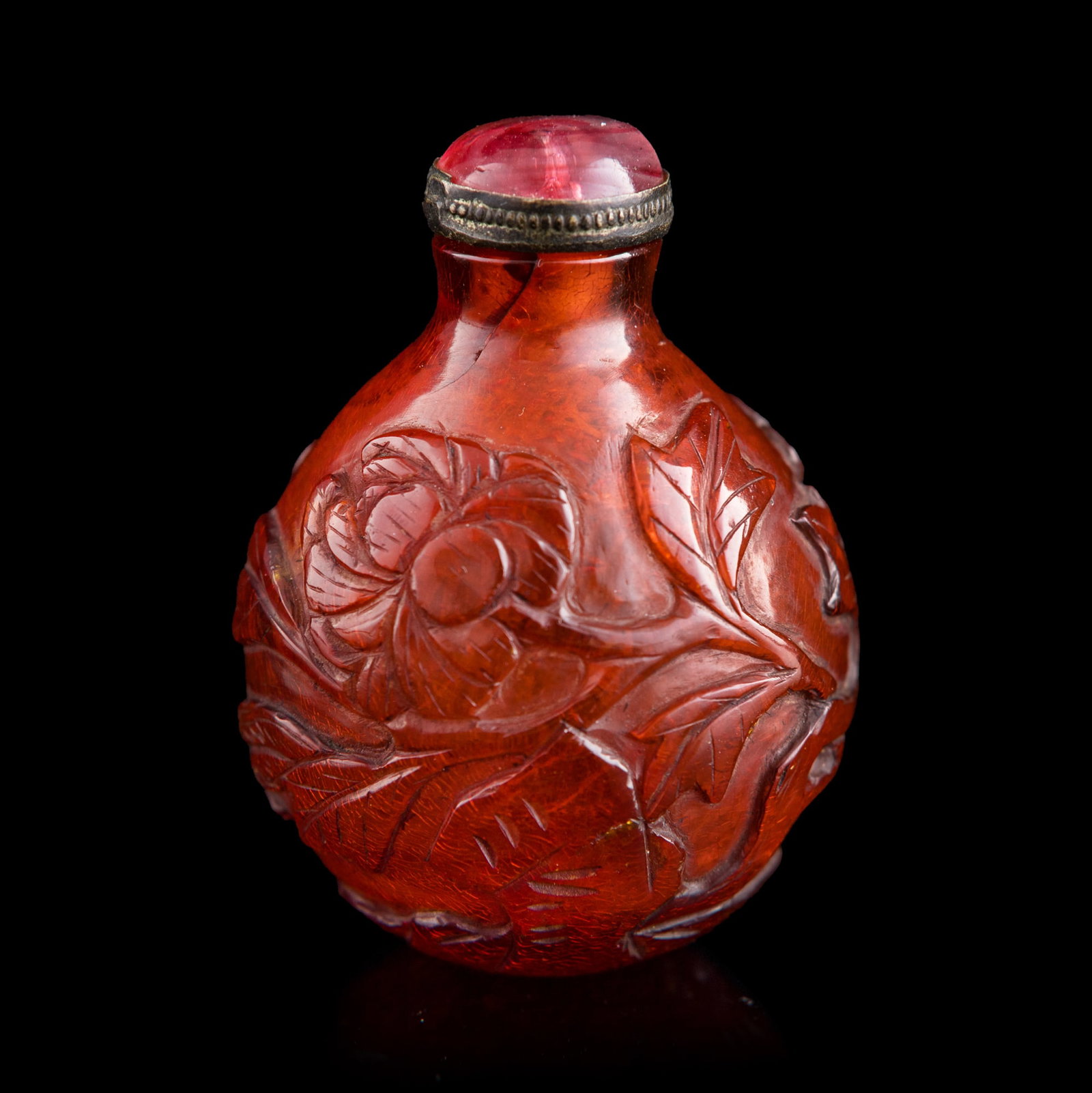 A Chinese amber 'flower and bird' snuff bottle, 18th century: A Chinese amber 'flower and bird' snuff bottle 18th century H: 2 1/4, W: 1 5/8, D: 1 1/2 in. (H: 5.7, W: 4.1, D: 3.8 cm.) Weight: 19.44 g (amber) Private collection, New York.