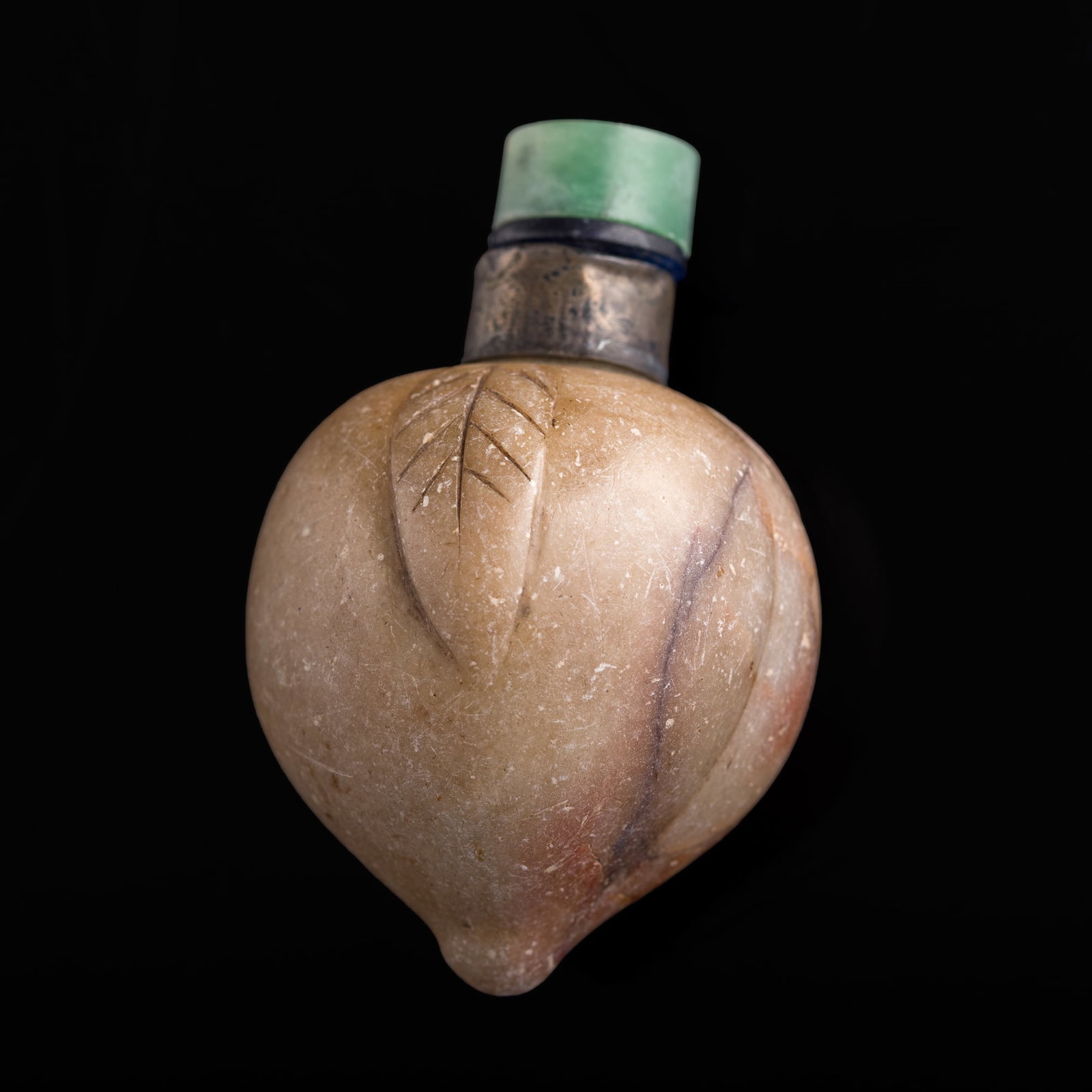 A Chinese Shoushan stone peach-form snuff bottle, 19th century: A Chinese Shoushan stone peach-form snuff bottle 19th century H: 2 3/4, W: 1 3/4, D: 1 7/8 in. (H: 7, W: 4.4, D: 4.8 cm.) Private estate, Central California.