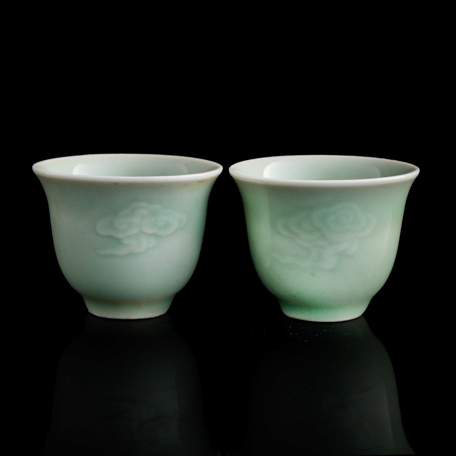 A pair of Chinese celadon 'cloud' cups, Republic period (1 of 8)