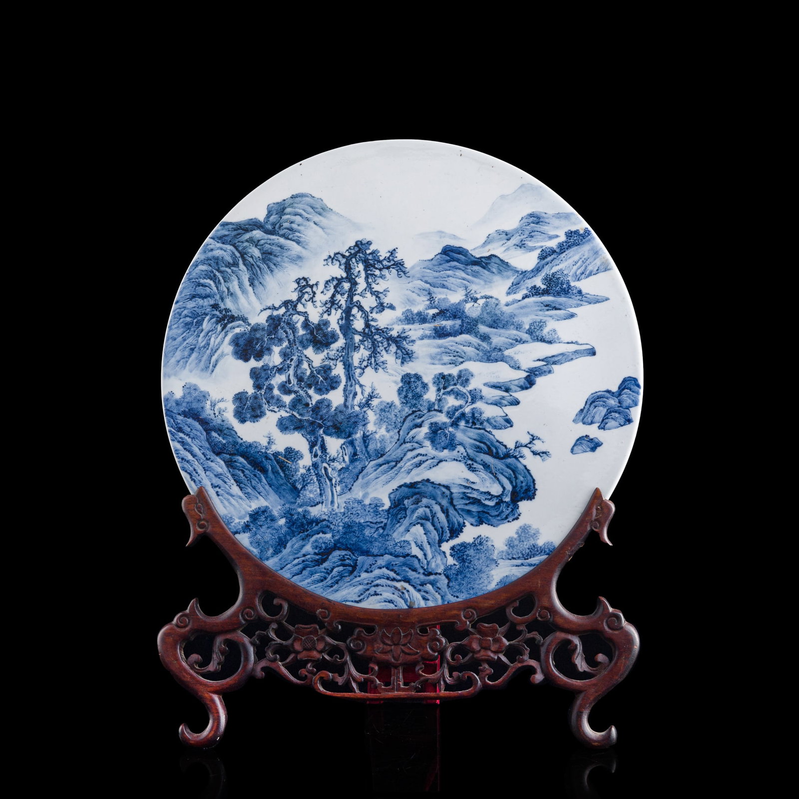 A Chinese blue and white 'landscape' roundel porcelain plaque, 1950s-1970s (1 of 8)